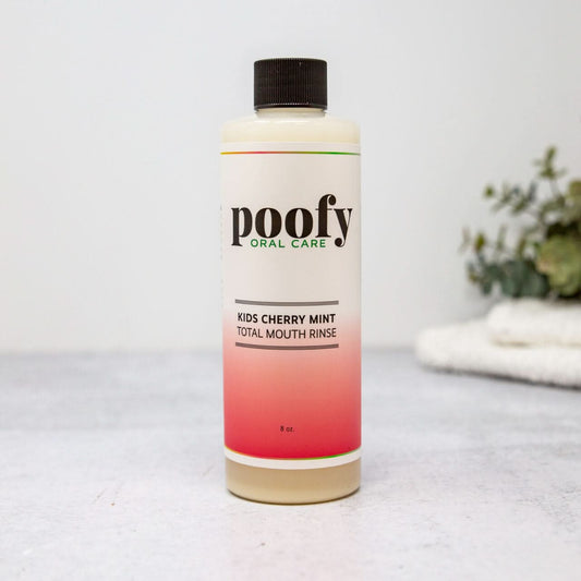 Kids Cherry Mint Total Mouth Rinse by Poofy Organics, in a clear bottle with a cherry and mint flavor label, for oral care.