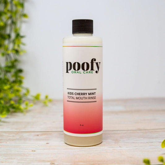 Kids Cherry Mint Total Mouth Rinse by Poofy Organics, natural oral care product with cherry and mint flavor in a clear bottle.