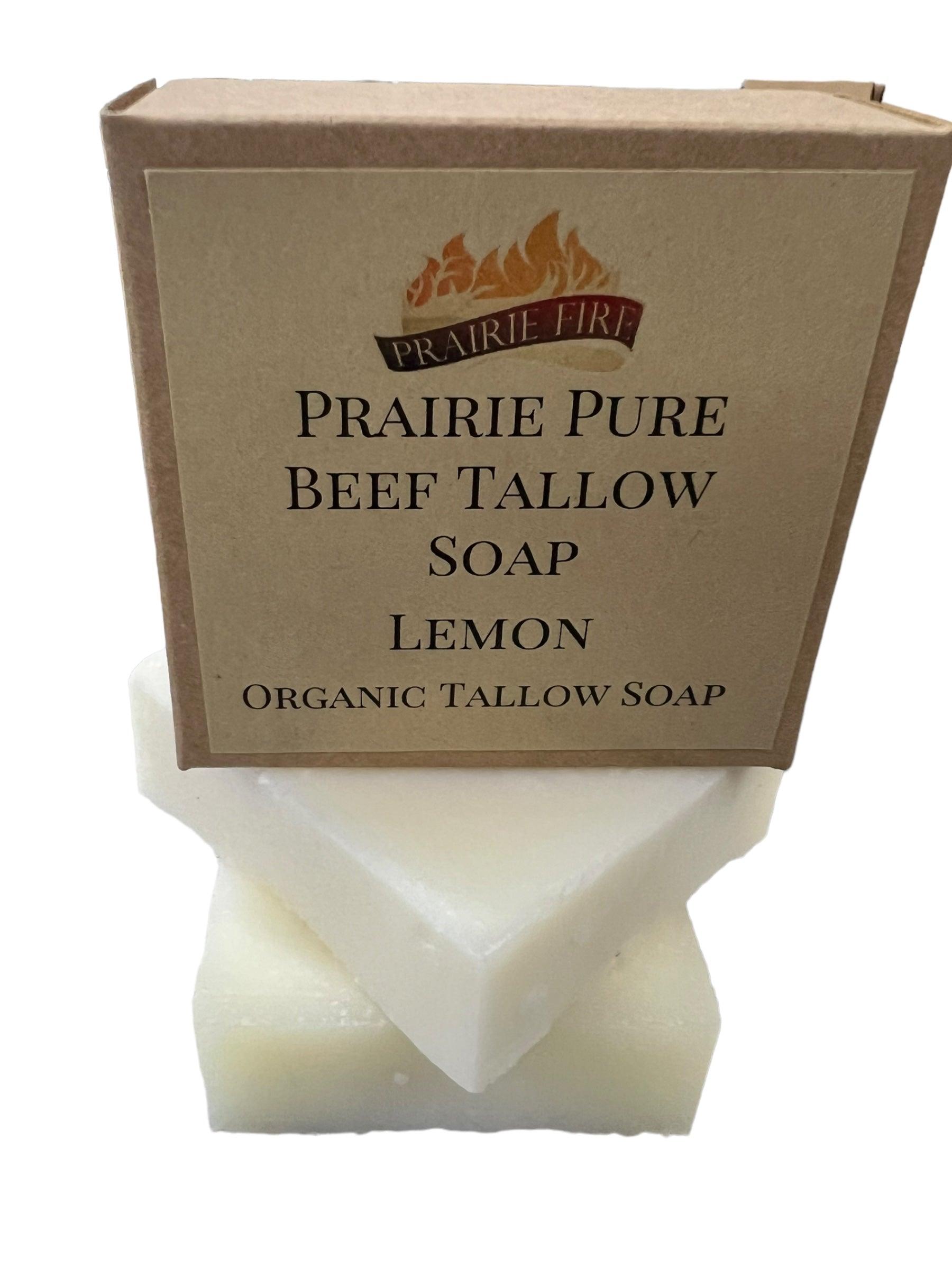 A box labeled Prairie Fire Tallow Pure Beef Tallow Soap Bar (3 Pack) sits atop two stacked white bars of natural, organic, grass-fed tallow soap for face, body, and hair—made in the USA to cleanse, moisturize, and soothe.