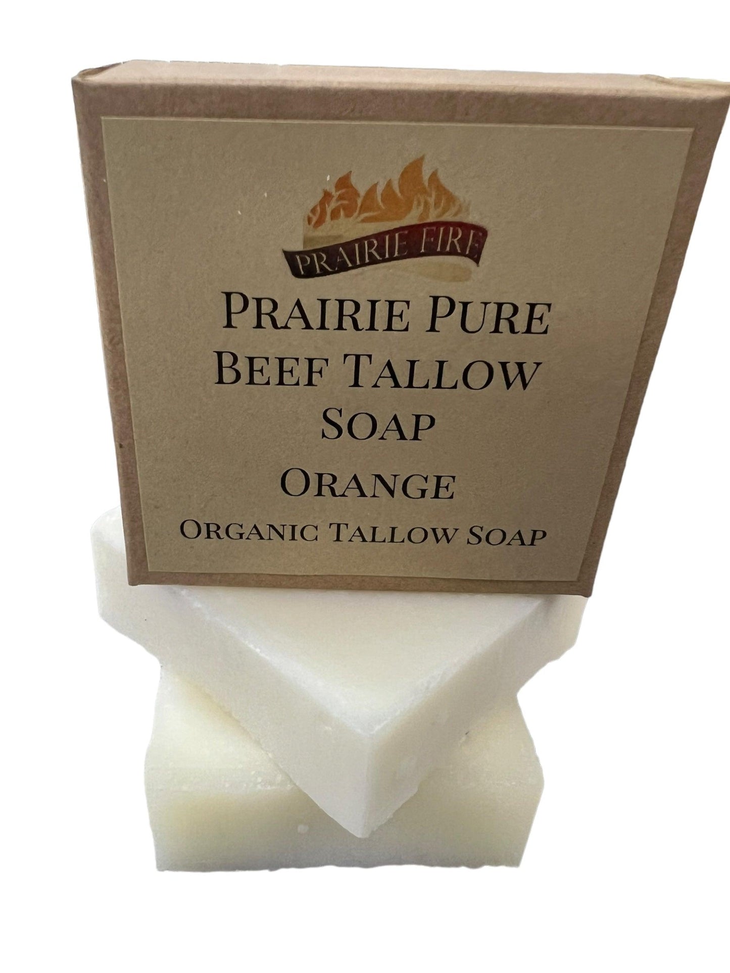 A brown Prairie Fire Tallow, Candles, and Lavender Pure Beef Tallow Soap Bar (3 Pack) box with a flame logo sits atop two white soap bars. The box highlights it’s natural, organic, and made in the USA from grass-fed beef tallow.