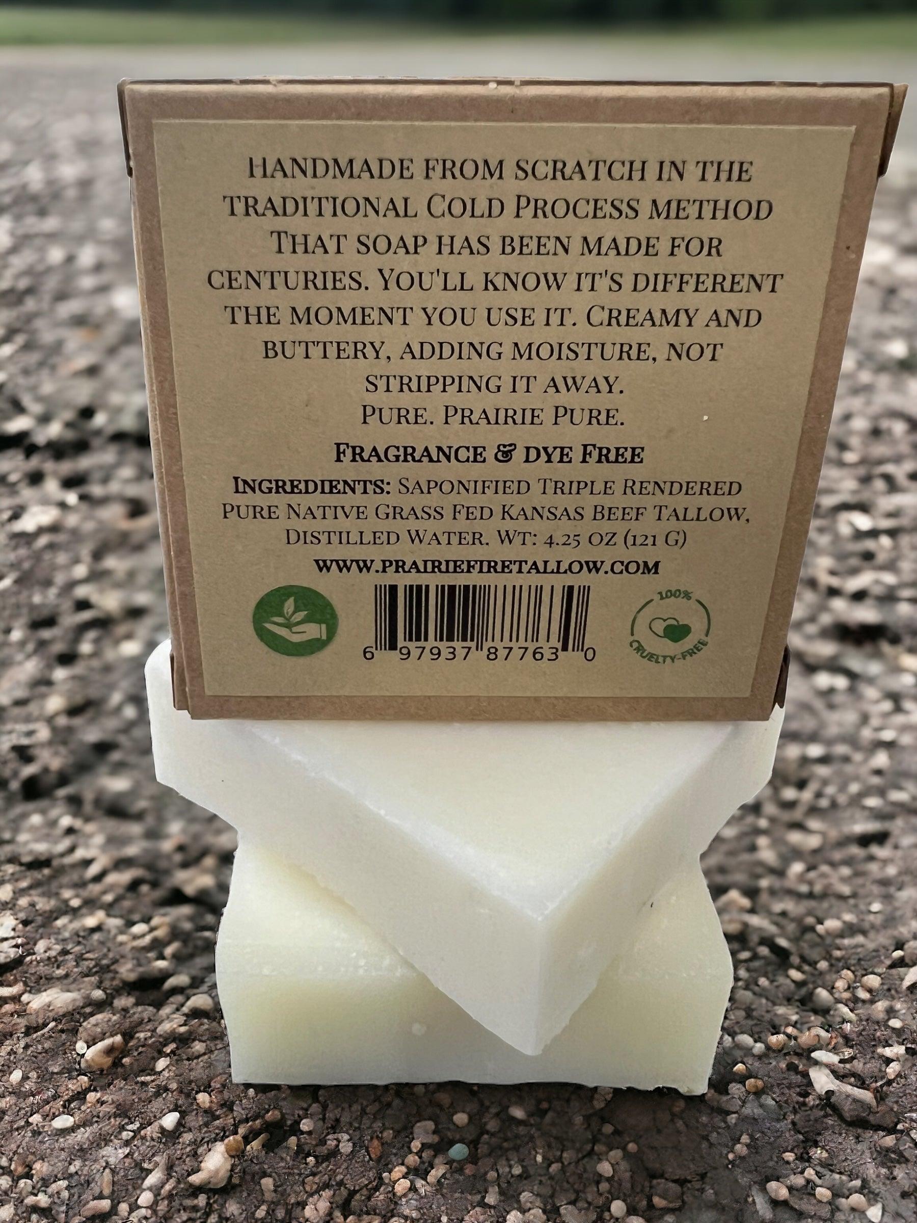 A trio of Prairie Fire Tallow’s Pure Beef Tallow Soap Bars rests on gravel, labeled as handmade, cold process, grass-fed and finished. The natural, organic soap is fragrance- and dye-free for face, body, and hair—cleans, moisturizes & soothes.