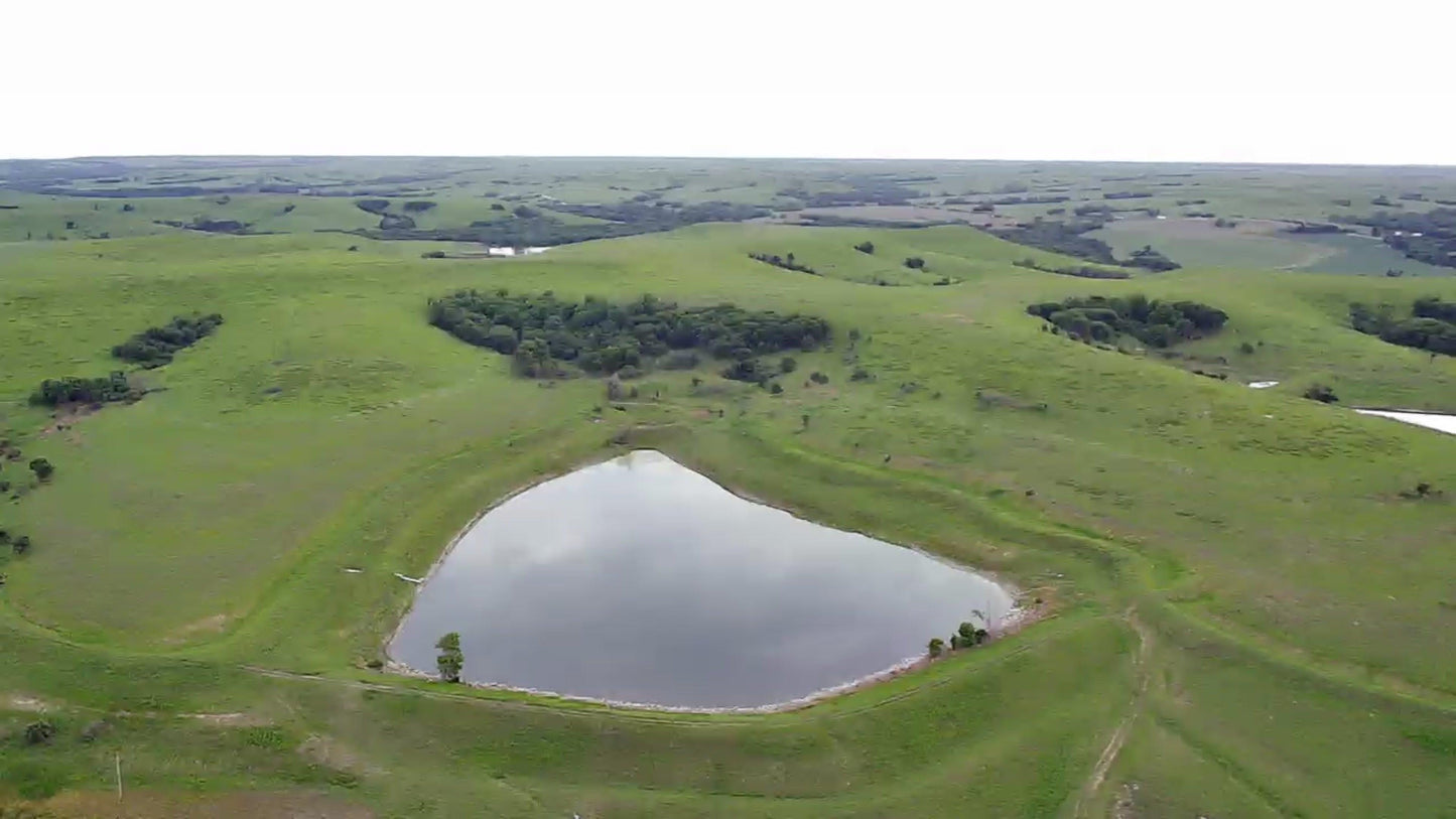 Aerial view of a heart-shaped pond amid green hills evokes the pure simplicity of nature—just like Prairie Fire Tallow’s 8 oz Organic Grass Fed Beef Tallow Balm, made in the USA for gentle, moisturizing skin care.