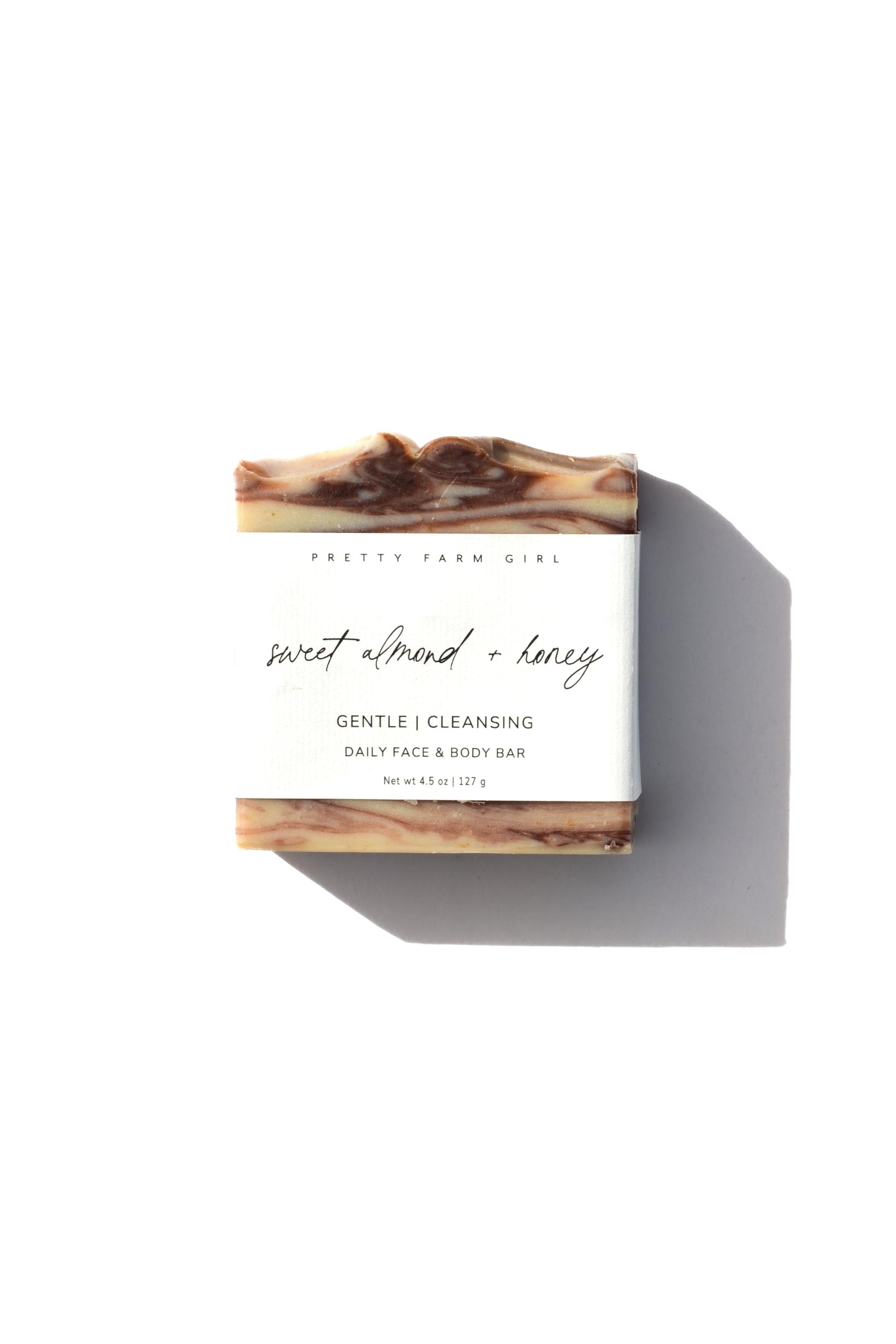 Handmade bar soap by Pretty Farm Girl with sweet almond, honey, tallow, and goat milk, featuring a creamy, natural soap bar.
