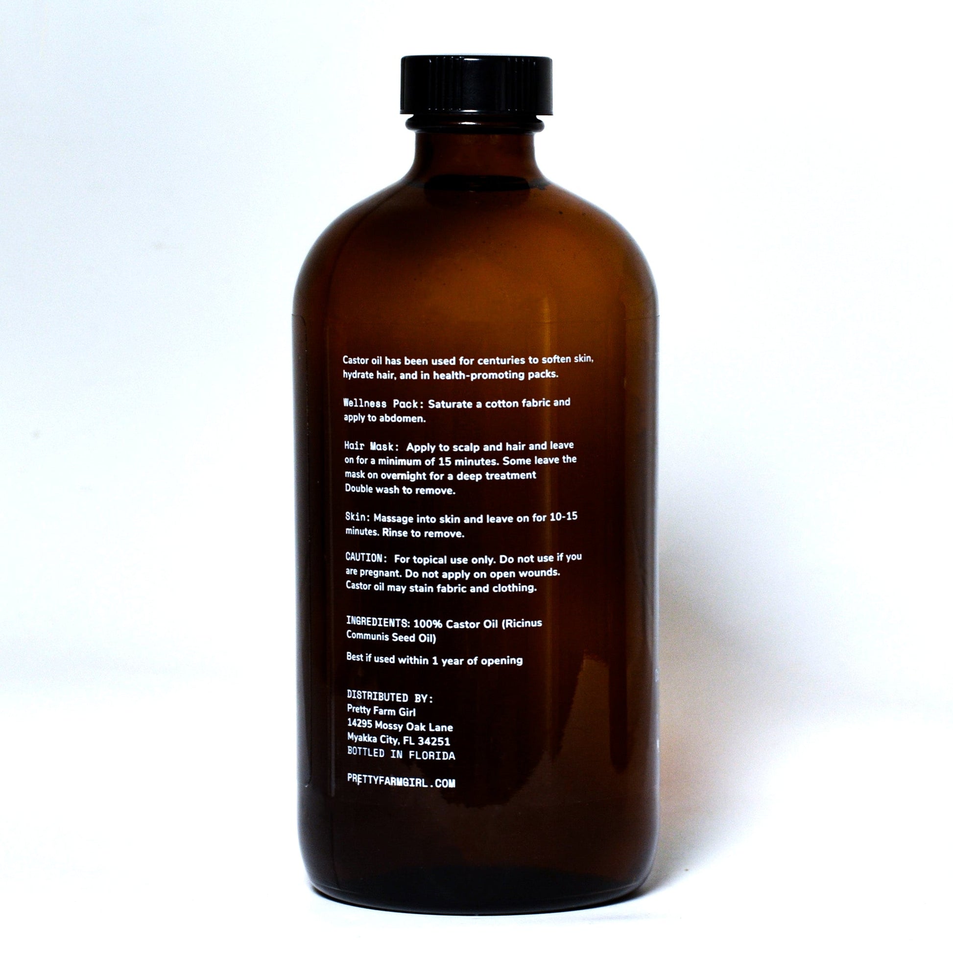 Pure organic castor oil in a 16 oz bottle from Pretty Farm Girl, cold-pressed and hexane-free essential oil for skin and hair.