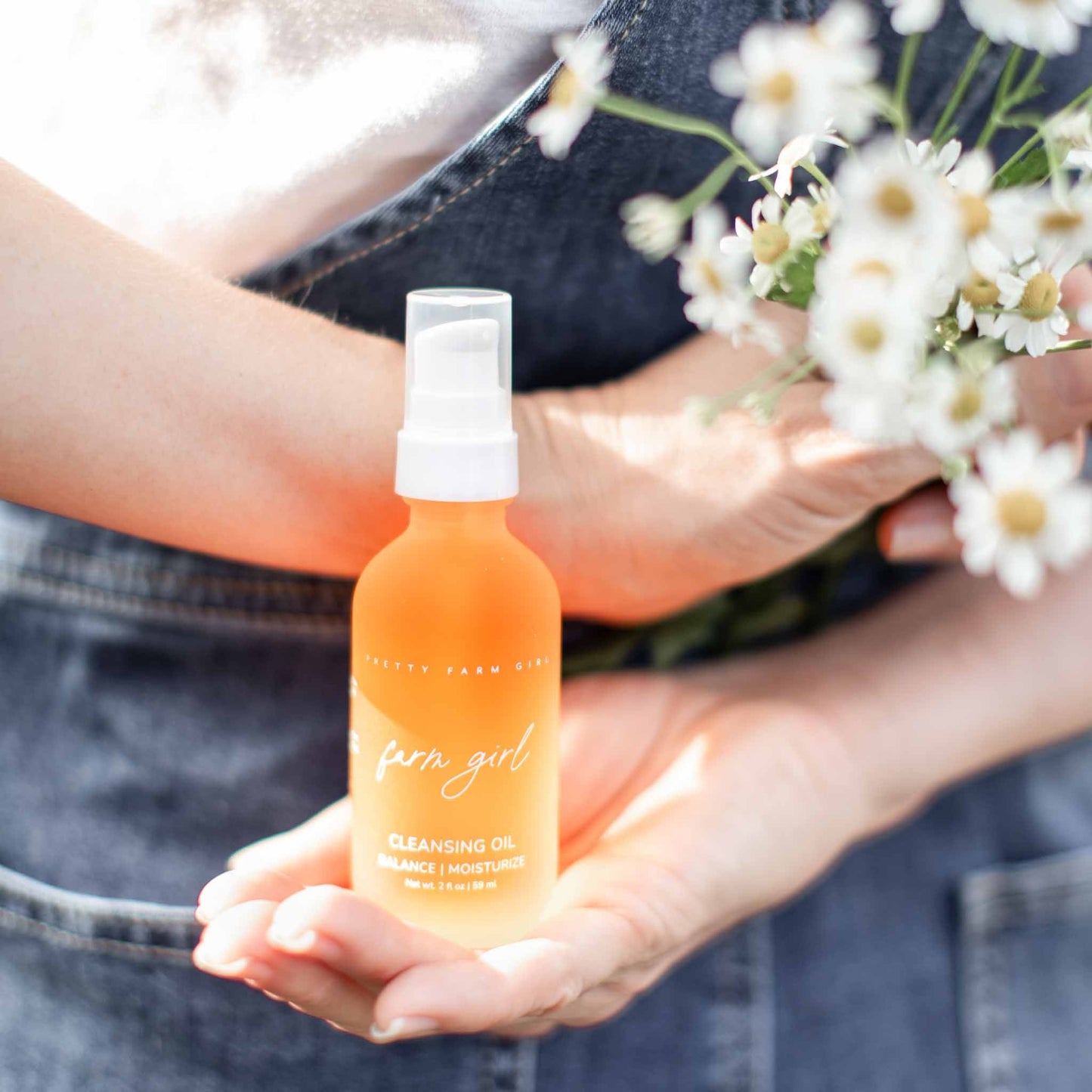 Pretty Farm Girl Face Cleansing Oil in a 2 oz bottle, natural farm-inspired face cleanser with gentle, nourishing ingredients.
