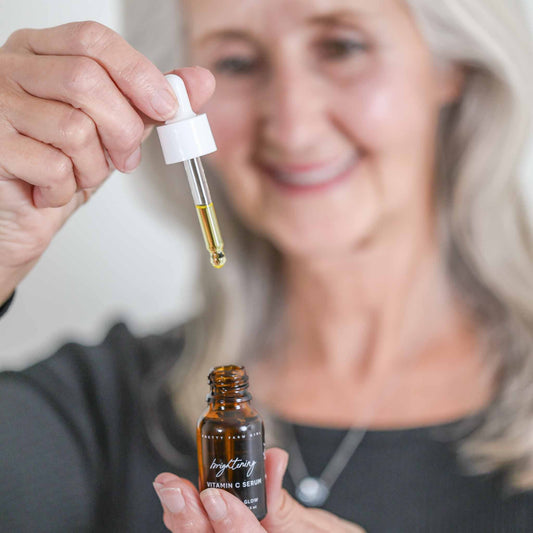 Pretty Farm Girl Brightening Vitamin C Face Serum in a sleek dropper bottle, designed to enhance skin radiance and clarity.