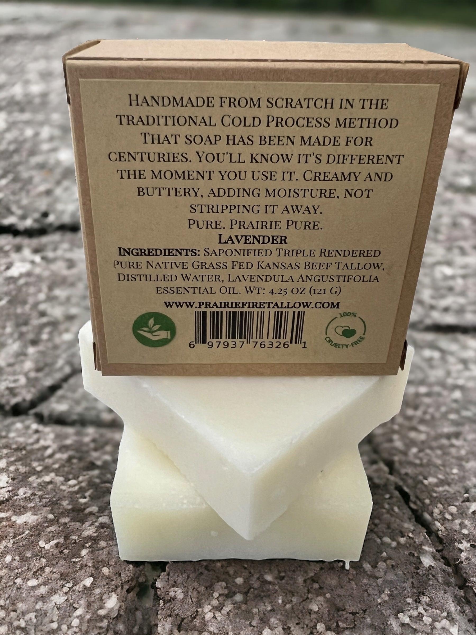 A pack of Prairie Fire Tallow Pure Beef Tallow Soap Bars sits outdoors on textured stone; made in the USA from grass-fed, finished tallow with lavender, it naturally cleans, moisturizes, soothes & hydrates face, body & hair.