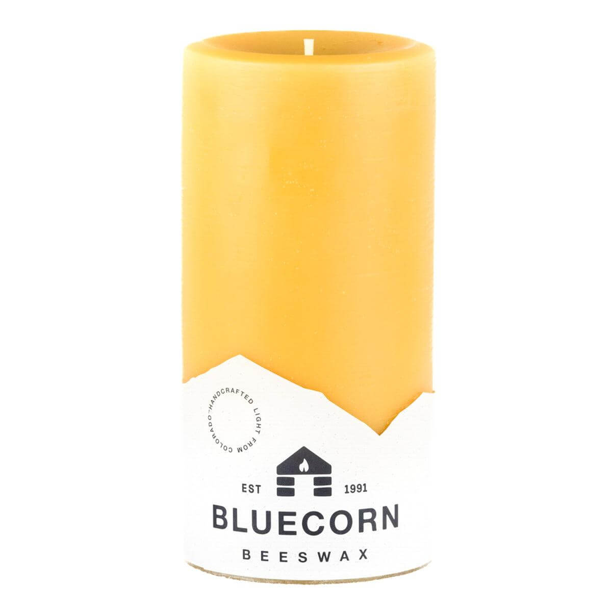 Set of Bluecorn Candles pure beeswax pillar candles in various heights with natural, warm-toned wax and simple, elegant design.