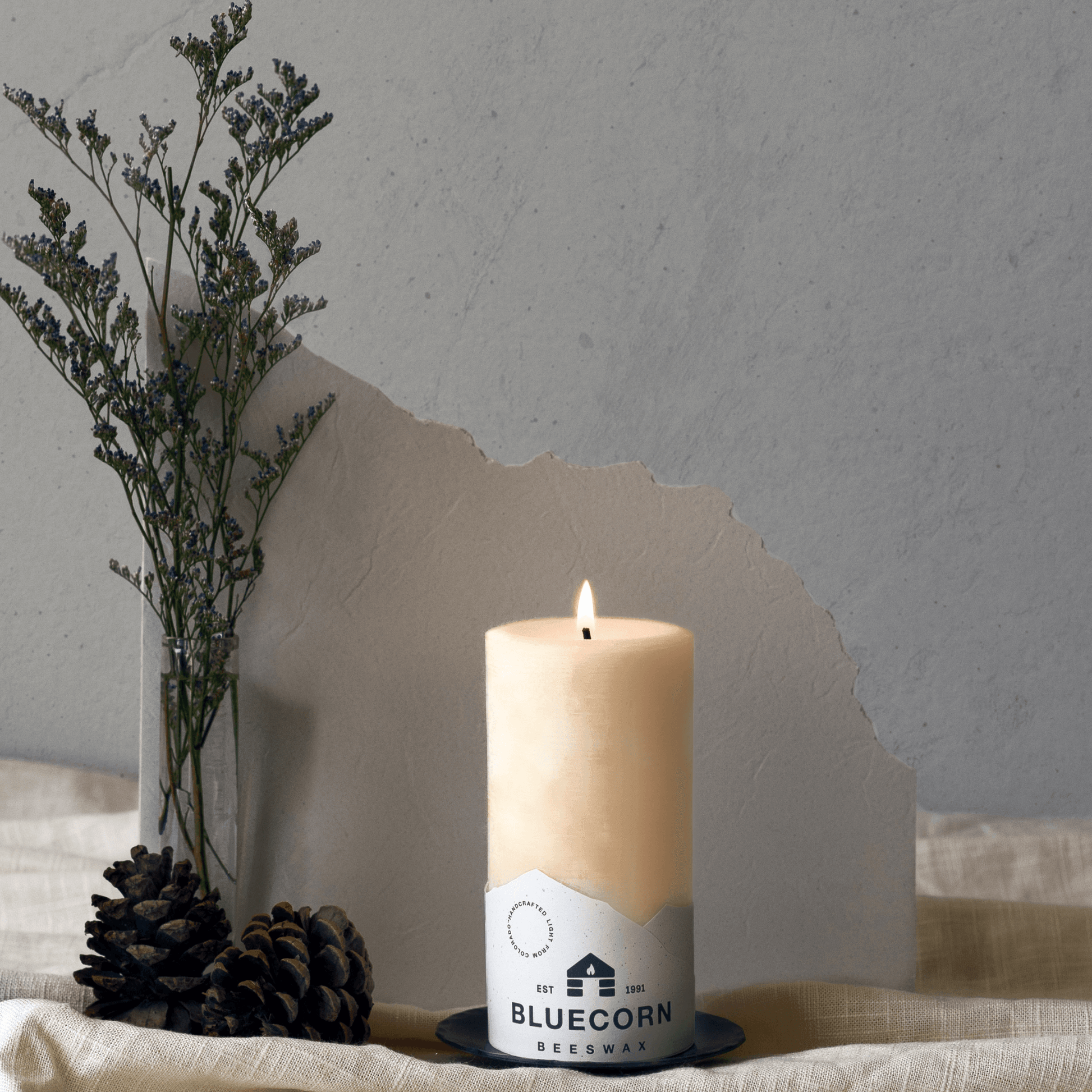 Ivory pure beeswax pillar candles by Bluecorn Candles, natural beeswax with smooth tapered design for ambient lighting.