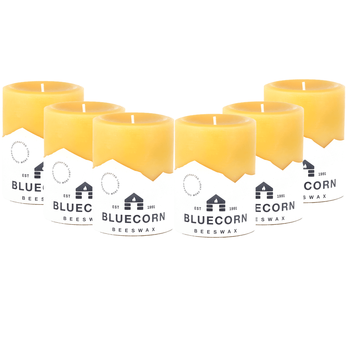 Set of Bluecorn Candles pure beeswax pillar candles in natural yellow, showing tall cylindrical shapes with unburned wicks.