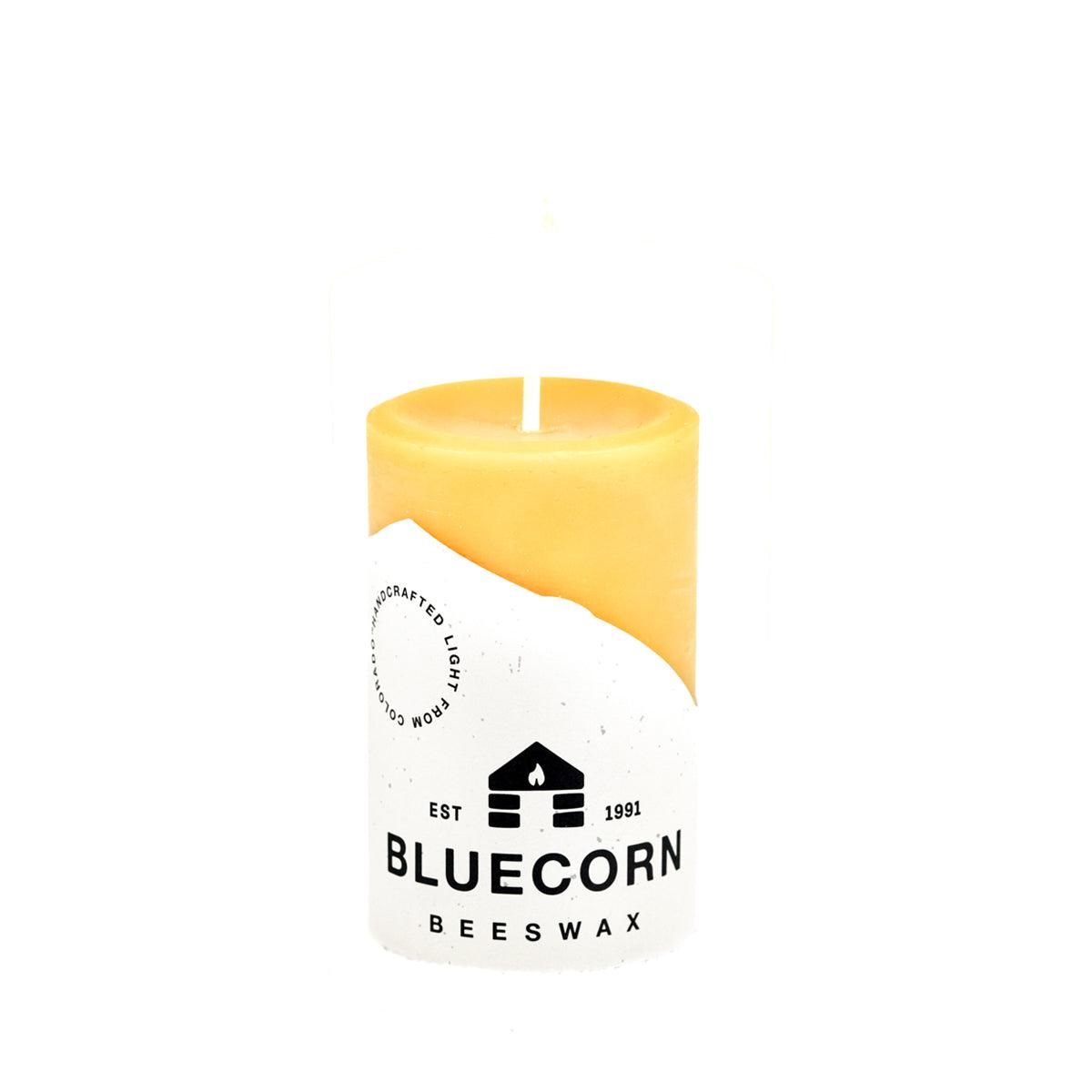 Set of three Bluecorn Candles pure beeswax pillar candles with natural, golden-hued wax and simple cylindrical design.