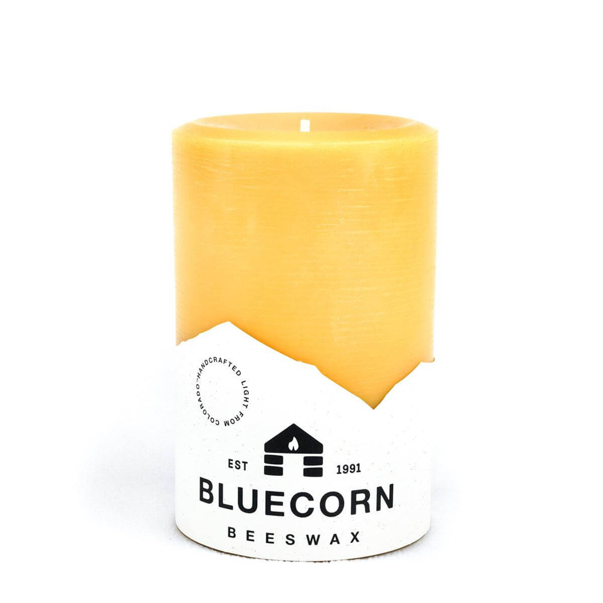Set of Bluecorn Candles pure beeswax pillar candles with natural honey color and smooth, cylindrical shape.