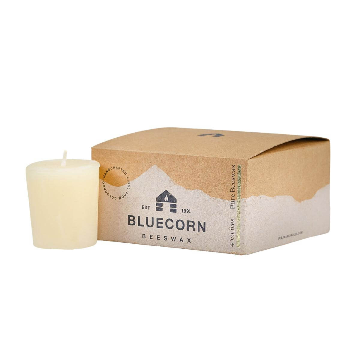 Set of eight pure beeswax votive candles from Bluecorn Candles, showing warm natural beeswax with wicks ready to light.