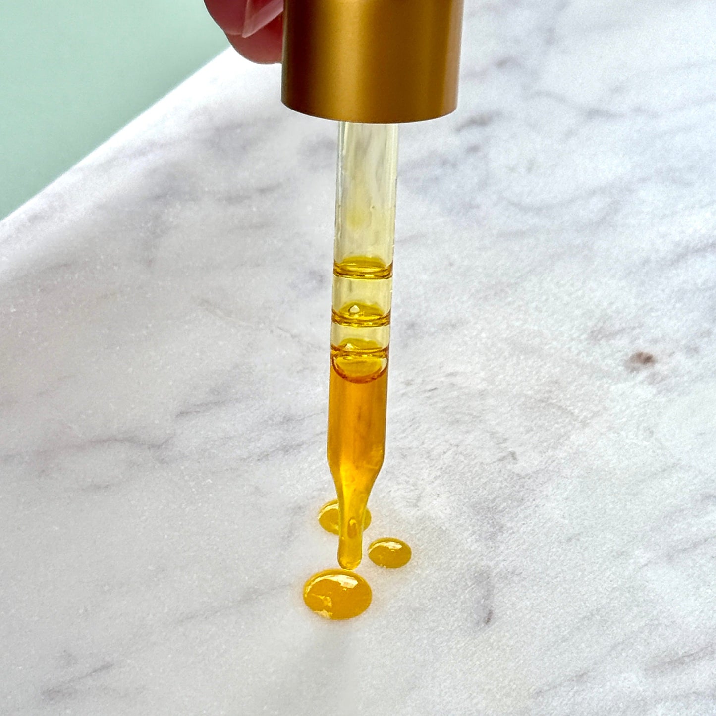 Clara & Fritz Tallow Shop Radiance Instant Glow Facial Serum in a sleek glass bottle with a dropper applicator.
