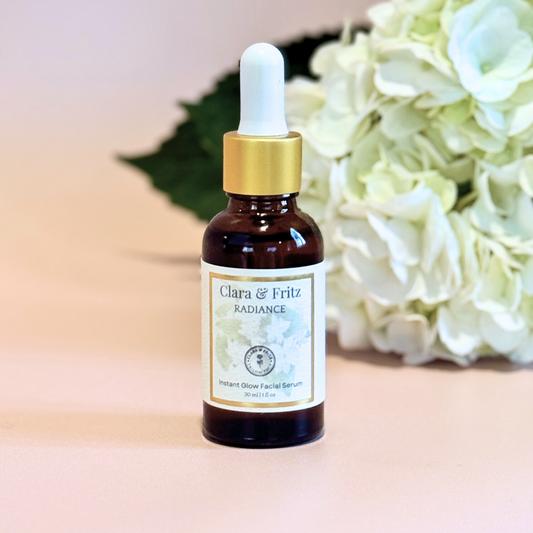 Clara & Fritz Tallow Shop Radiance Instant Glow Facial Serum bottle with dropper, highlighting luminous skincare product.