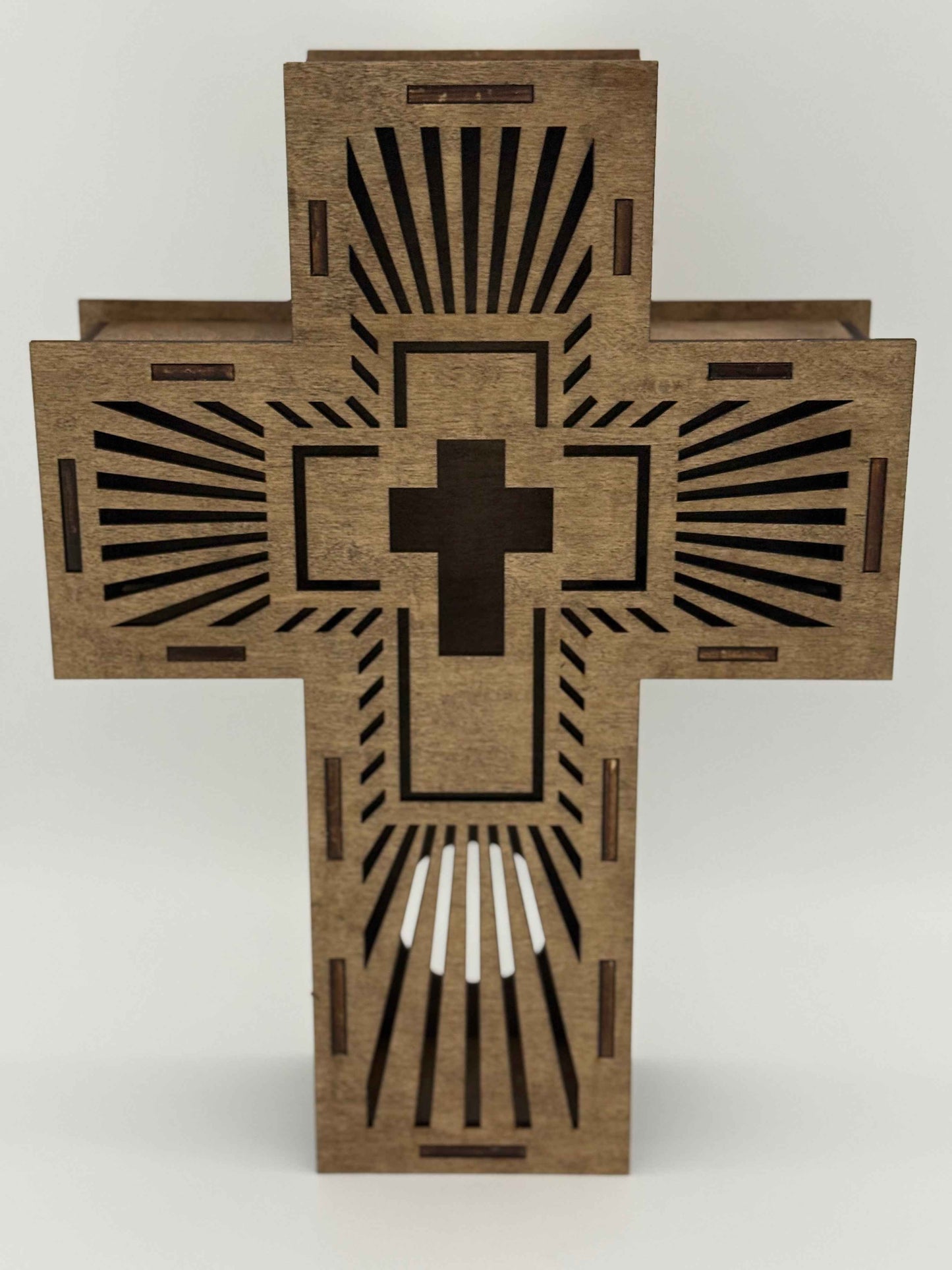 Laser-engraved wooden Radiant Cross wall art with illuminated design, spiritual decor by C2 Creations LLC.