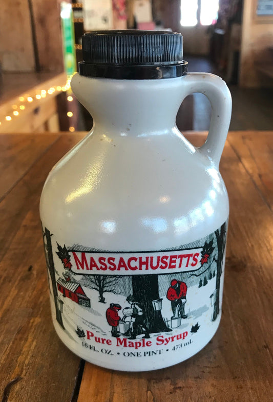 Pint of Massachusetts Maple Syrup from Red Apple Farm, showcasing the rich, amber syrup in a clear glass bottle.