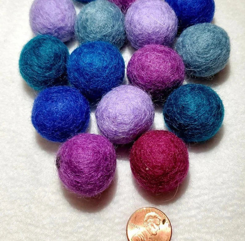 Organic wool cat ball toys from ReNewedPet, featuring soft, colorful wool balls perfect for playful cats.