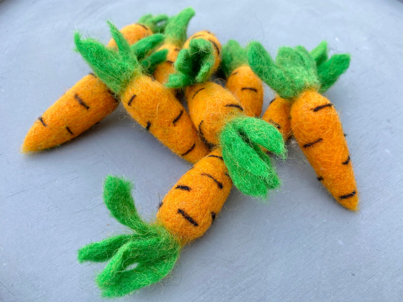 Felted cat toy carrots from ReNewedPet's Fun Stuff! Soft, colorful felted toys designed for cats to play with and chew.