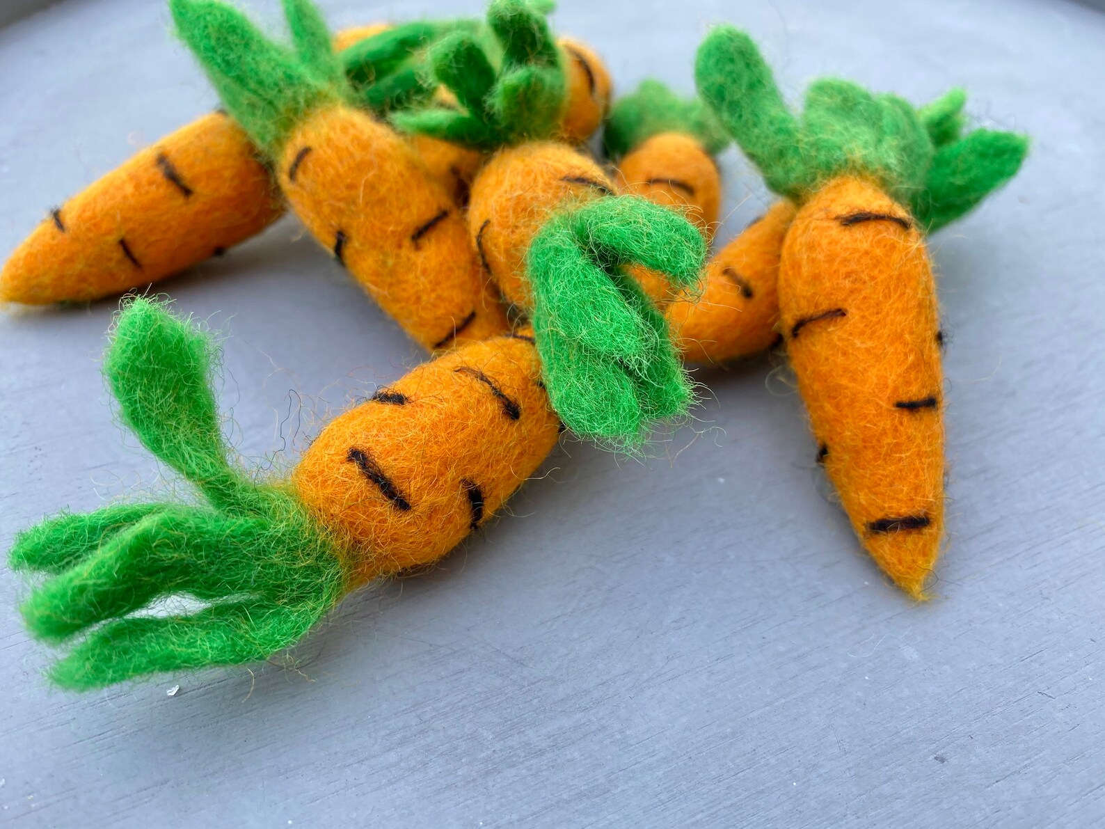 Felted cat toy carrots from ReNewedPet's Fun Stuff! Soft, colorful plush toys designed for cats to play and chew.