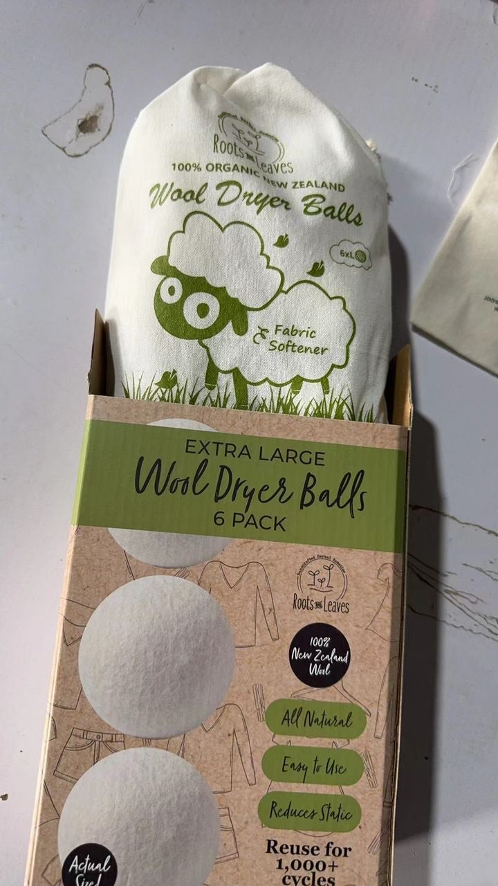 Set of New Zealand wool dryer balls from Roots and Leaves LLC, natural felted wool for eco-friendly fabric drying.