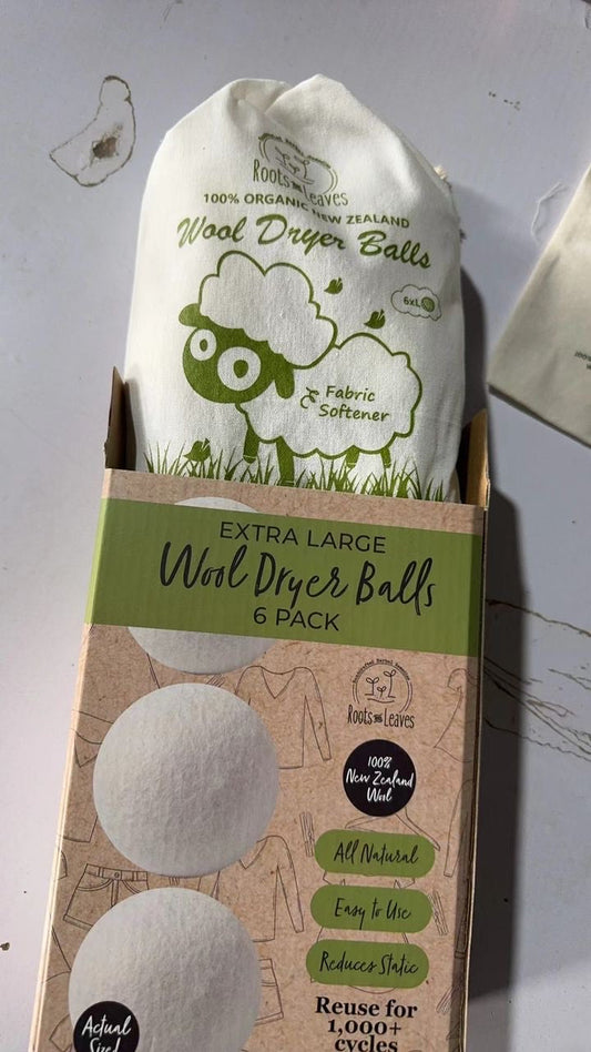 Set of New Zealand wool dryer balls from Roots and Leaves LLC, natural felted wool for eco-friendly fabric drying.