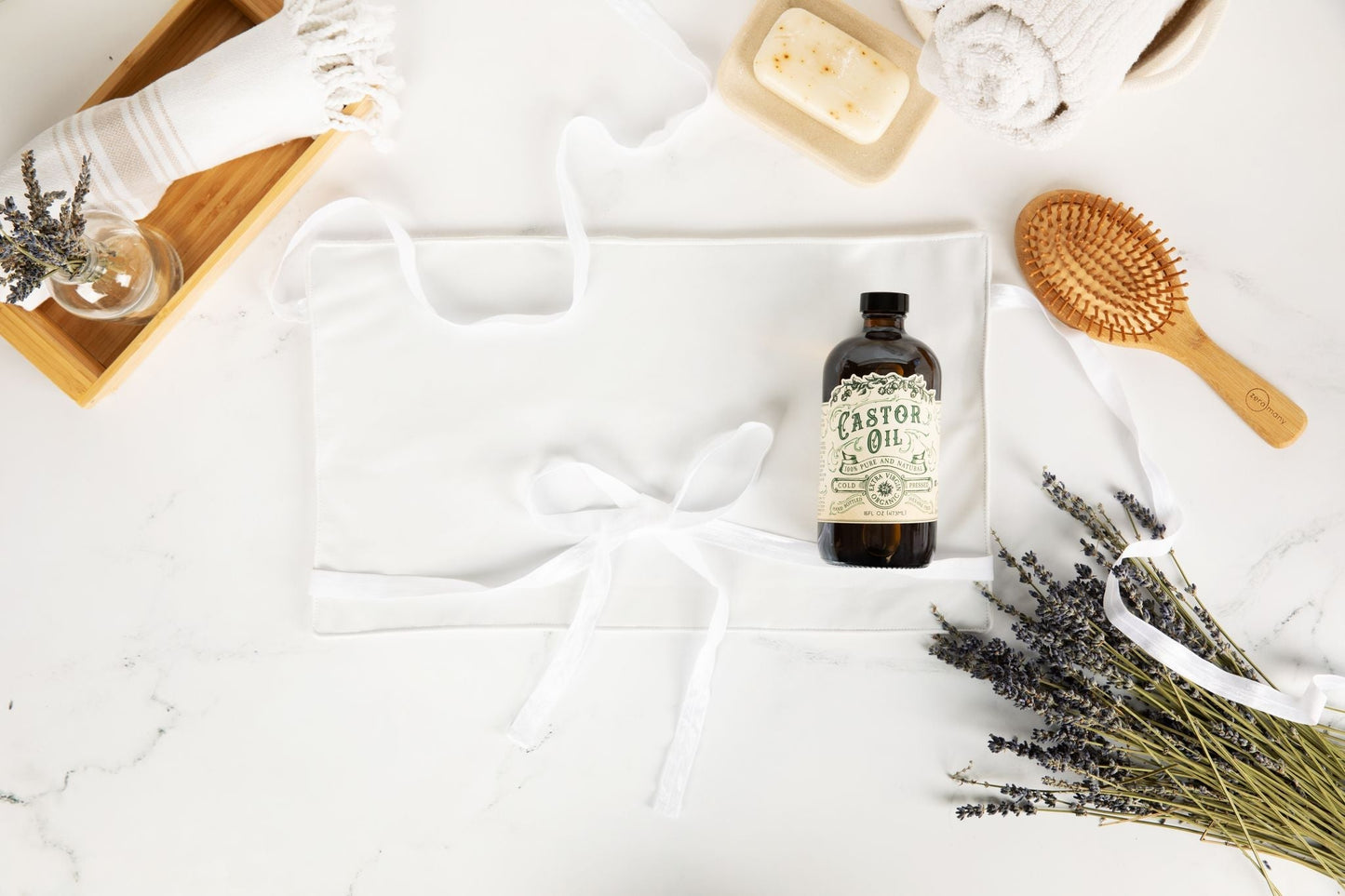 Organic cold pressed hexane free castor oil by Roots and Leaves LLC in a 16 oz bottle, showing clear oil inside a glass container.