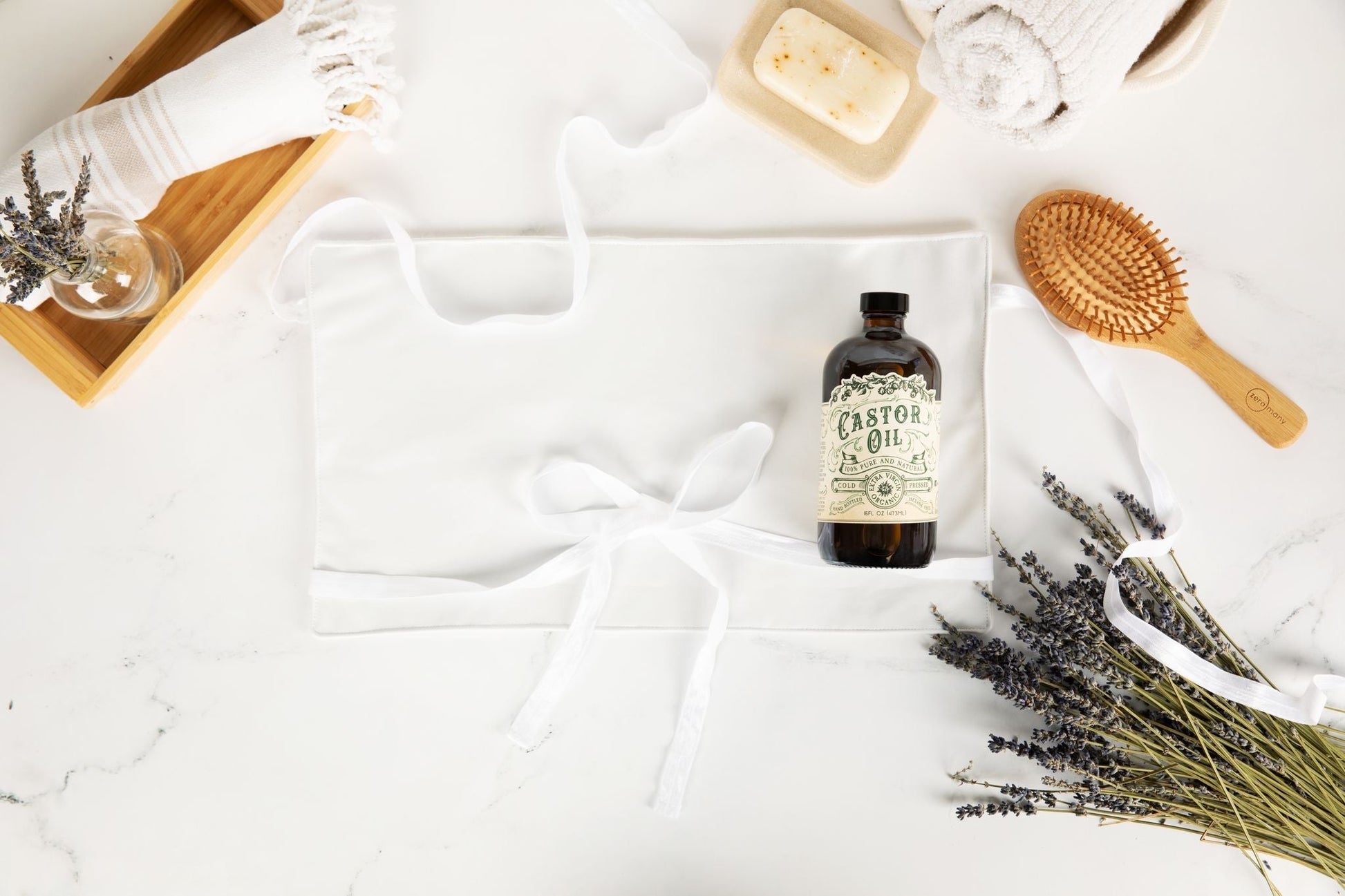 Organic cold pressed hexane free castor oil by Roots and Leaves LLC in a 16 oz bottle, showing clear oil inside a glass container.
