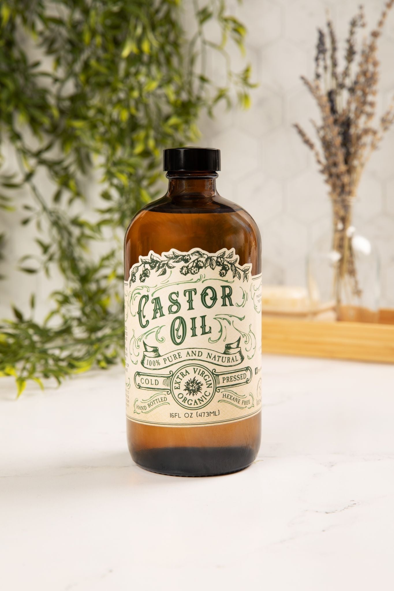 Organic cold pressed castor oil by Roots and Leaves LLC in a 16 oz bottle, showing the clear, golden liquid inside.