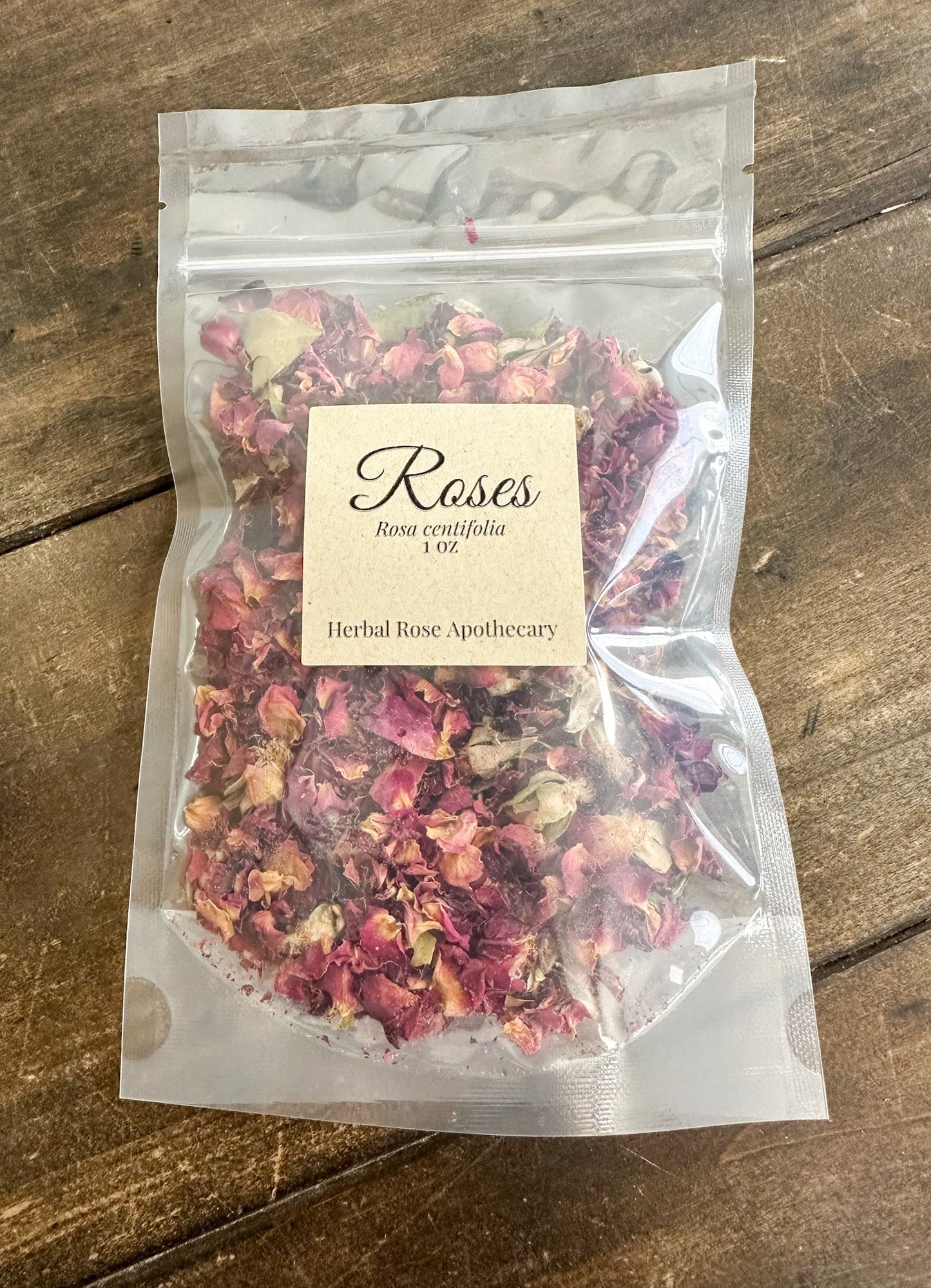 Close-up of 1 oz of dried herbal rose petals from herbalroseapothecary, showcasing vibrant pink and red petals for tea or craft use.