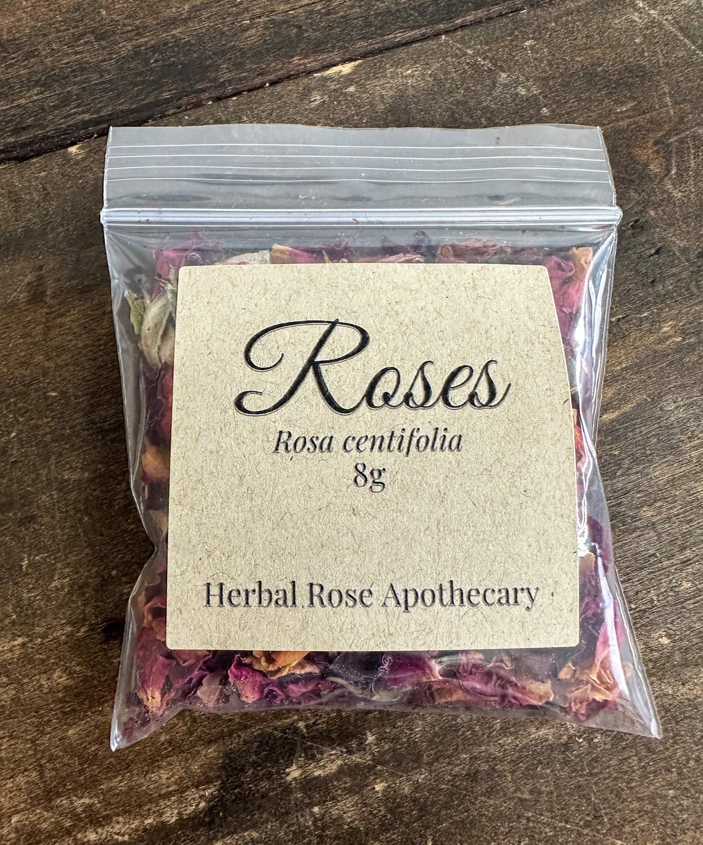 Dried herbal rose petals in an 8g package, vibrant pink and red rose petals for herbal remedies and decorative use.