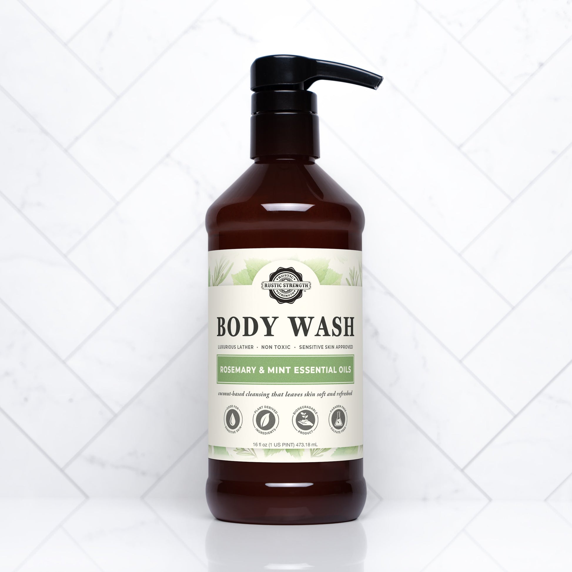 Rustic Strength moisturizing body wash in rosemary and mint, showing a 16 oz bottle with fresh herbs and a natural, calming design.