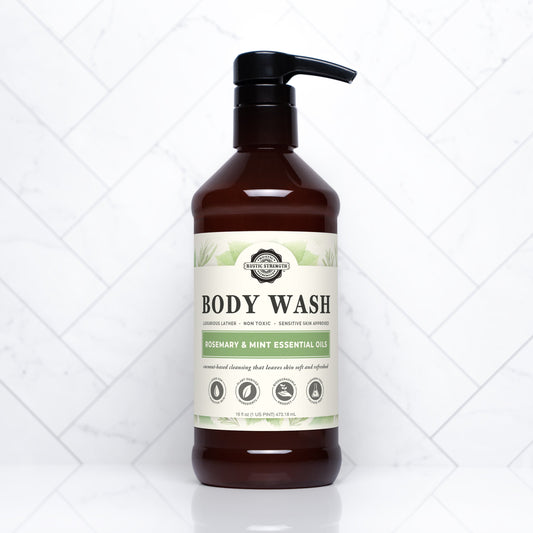 Rustic Strength moisturizing body wash in rosemary and mint, showing a 16 oz bottle with fresh herbs and a natural, calming design.