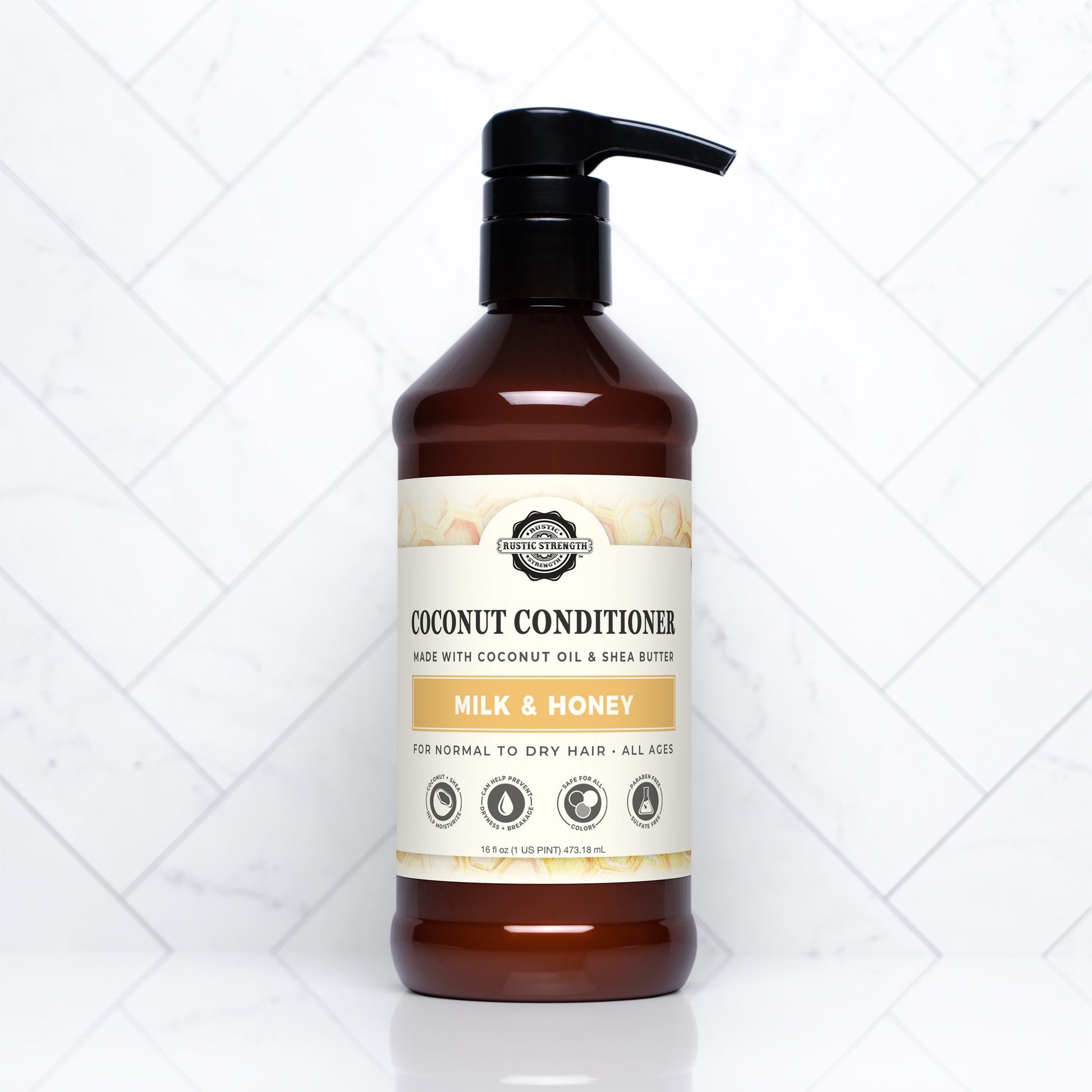 Rustic Strength Coconut Conditioner with Milk & Honey in a 16 oz bottle, featuring a creamy, nourishing formula for healthy hair.