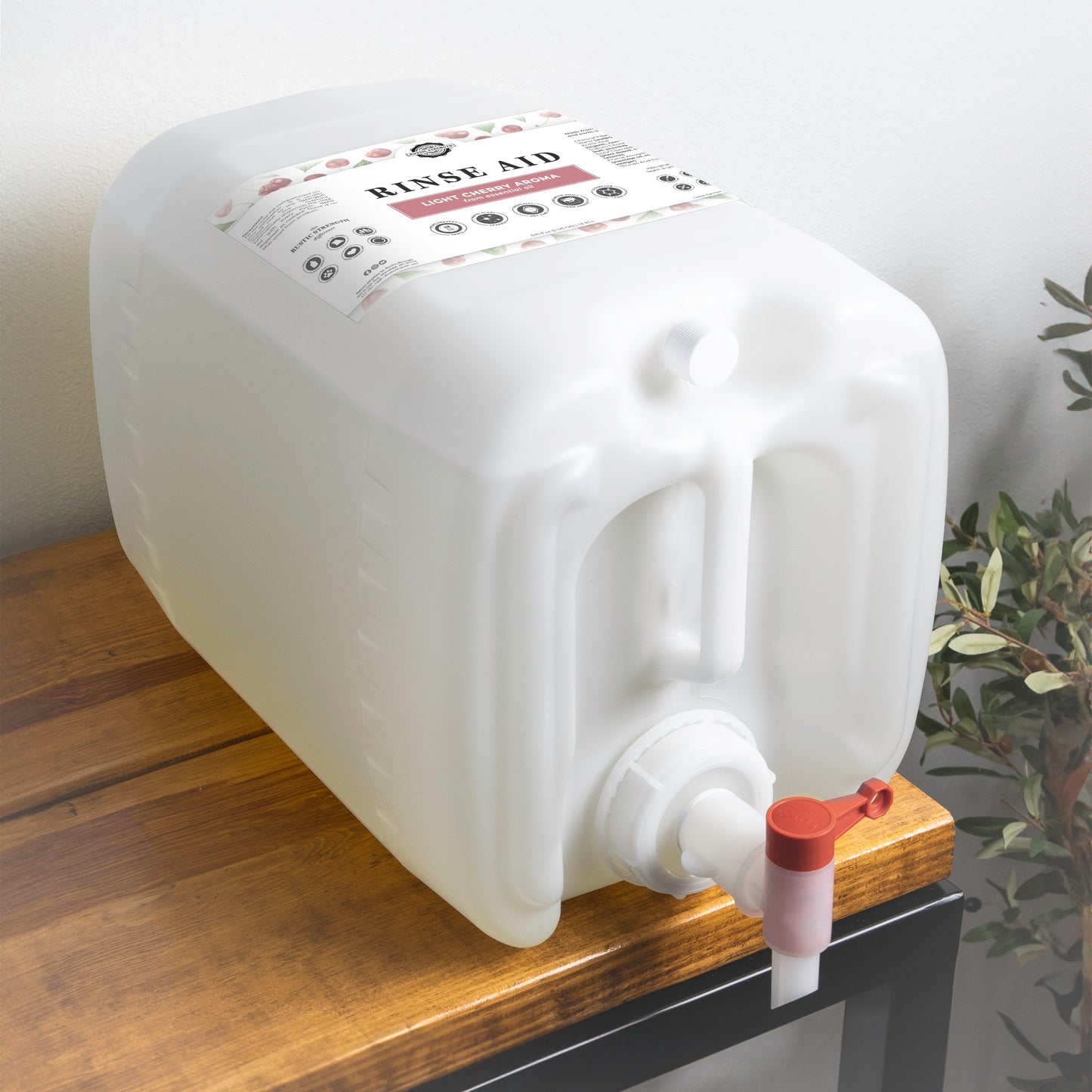 Rustic Strength light cherry rinse aid for automatic dishwashers in a 16 oz bottle with flip-top spout.