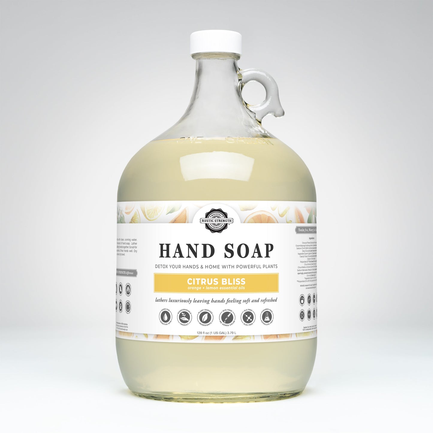 A clear gallon jug of Rustic Strength Hand Soap | Citrus Bliss features a white cap and handle. The label shows citrus fruit graphics and product info on a plain white background.