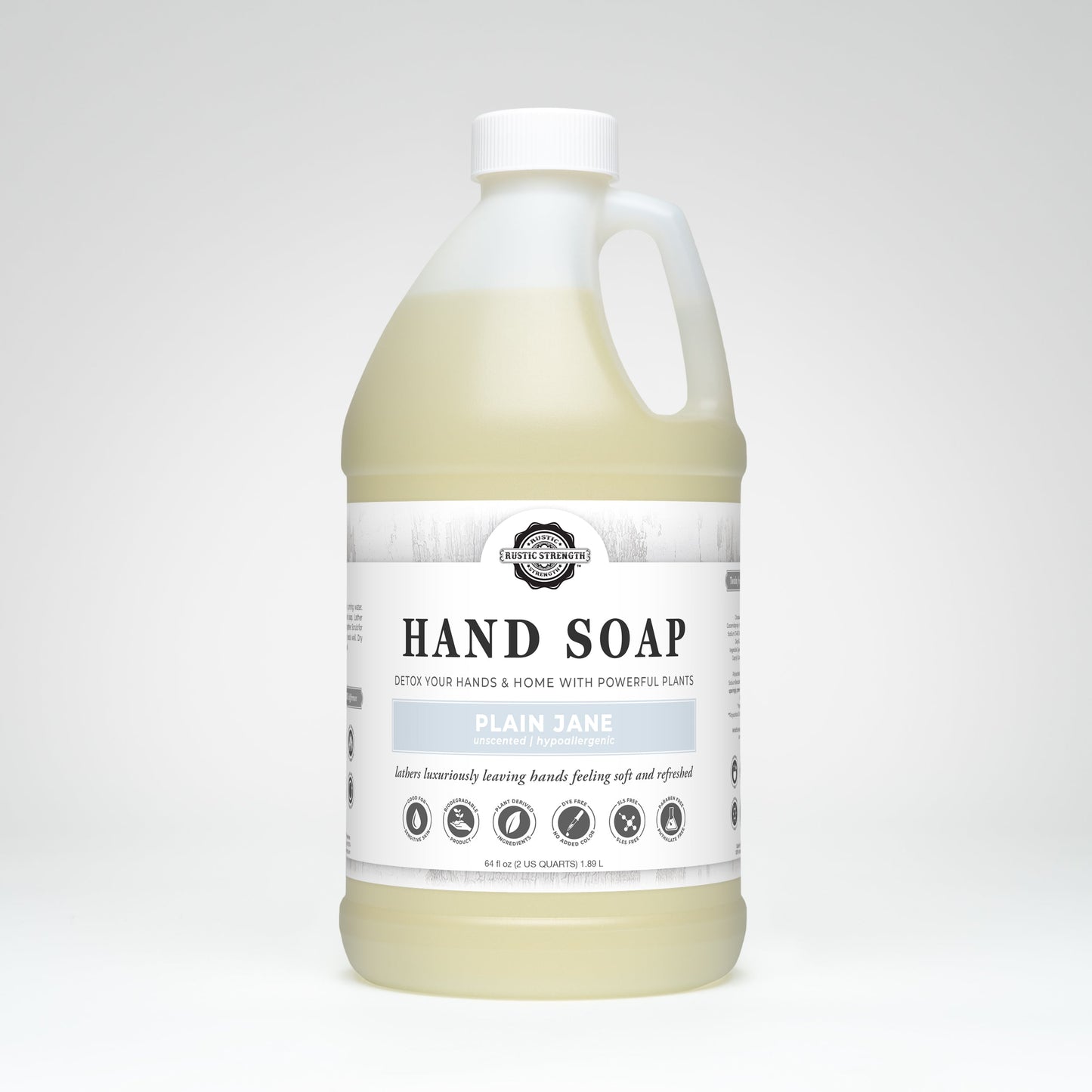 A large plastic jug of Rustic Strength Hand Soap | Plain Jane with a white and gray label. This plant-based, non-toxic, cruelty-free, biodegradable soap is gentle for sensitive skin and made in the USA.