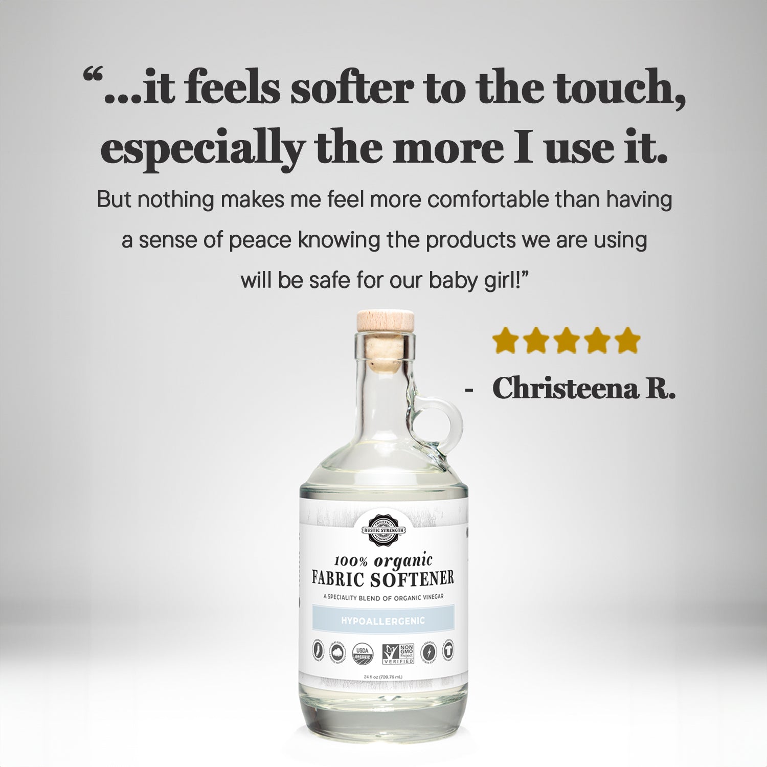 Rustic Strength Organic Fabric Softener in a 24 oz glass bottle, used for laundry to soften and freshen clothes naturally.