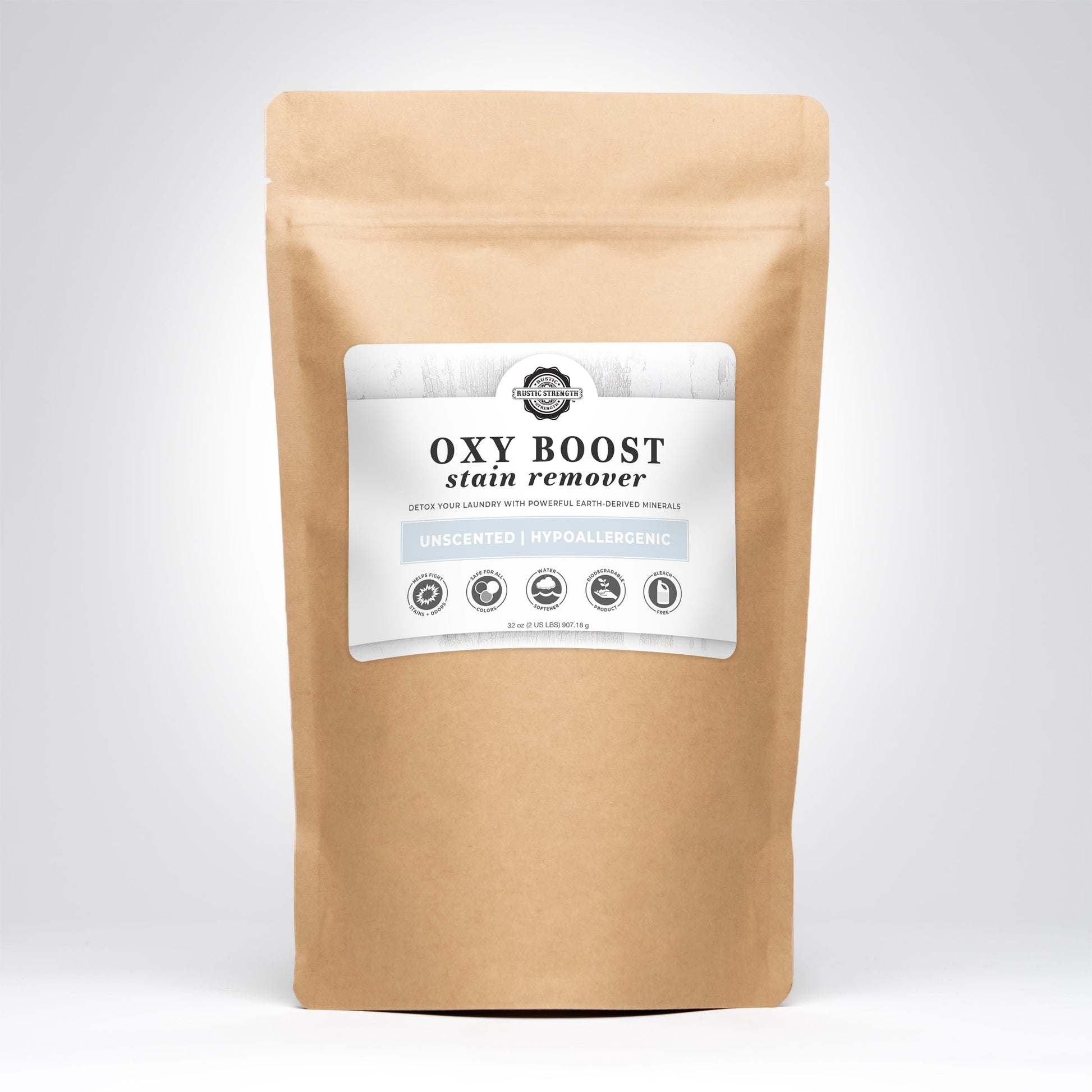 A brown resealable bag of Rustic Strength Oxy Boost Stain Remover stands upright against a plain light background, labeled as toxin free, unscented, hypoallergenic, and made with powerful earth-derived minerals.