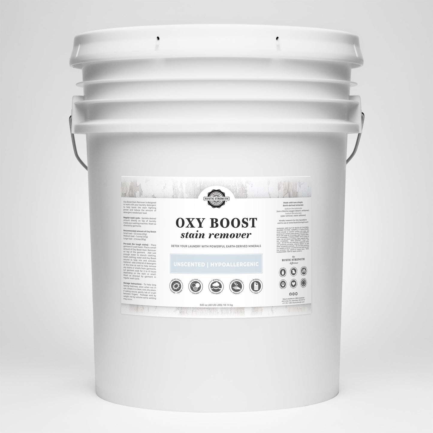 The Rustic Strength Oxy Boost Stain Remover comes in a large white plastic bucket with a handle. The label notes it is toxin-free, color-safe, unscented, hypoallergenic, eco-friendly, and suitable for versatile cleaning.