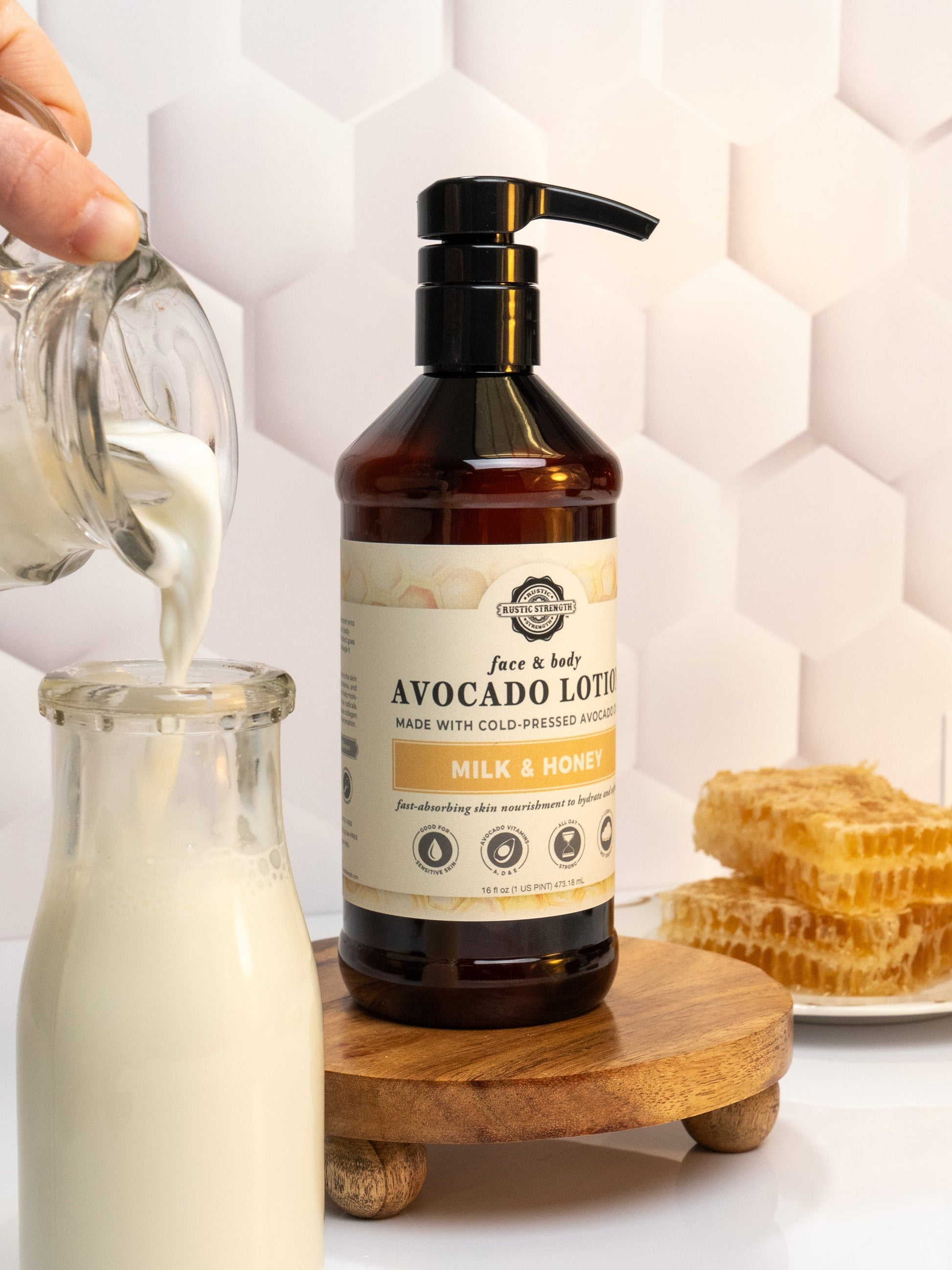Rustic Strength Avocado Lotion with Milk & Honey in a 16 oz bottle, featuring a creamy, moisturizing formula for soft skin