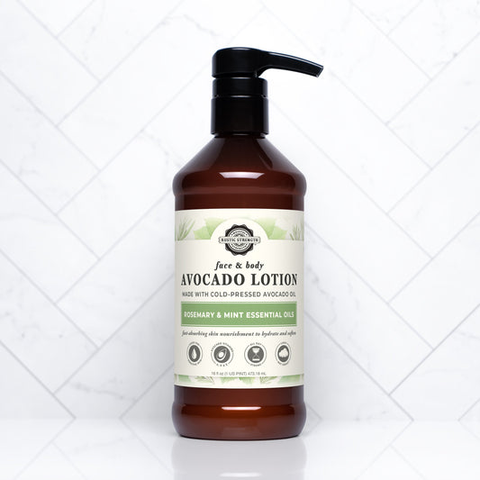 Rustic Strength Avocado Lotion with Rosemary and Mint, 16 oz, creamy moisturizer in a white bottle with green accents.