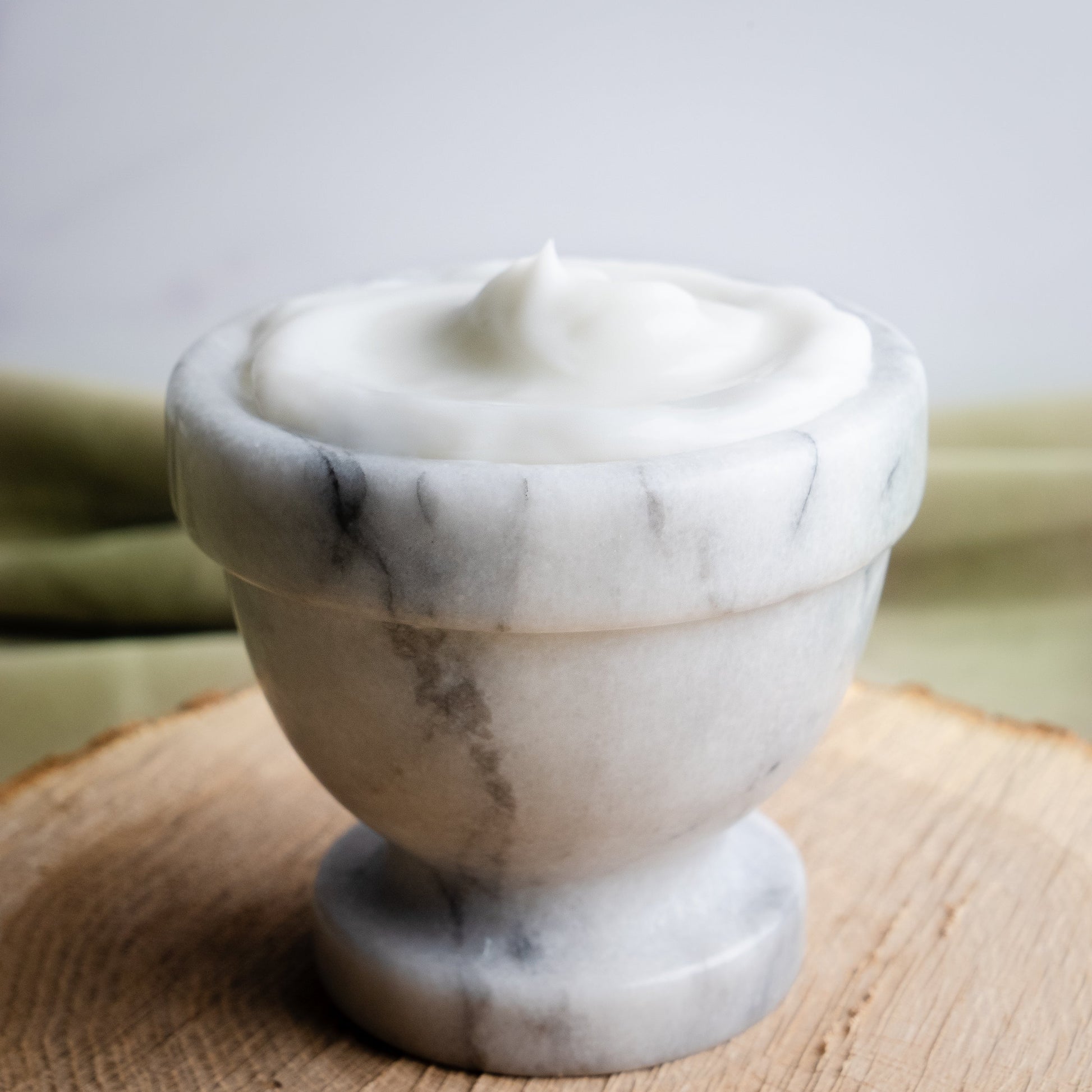 Rustic Strength Avocado Lotion with Rosemary and Mint, 16 oz bottle showing the nourishing lotion texture and fresh herbal ingredients.
