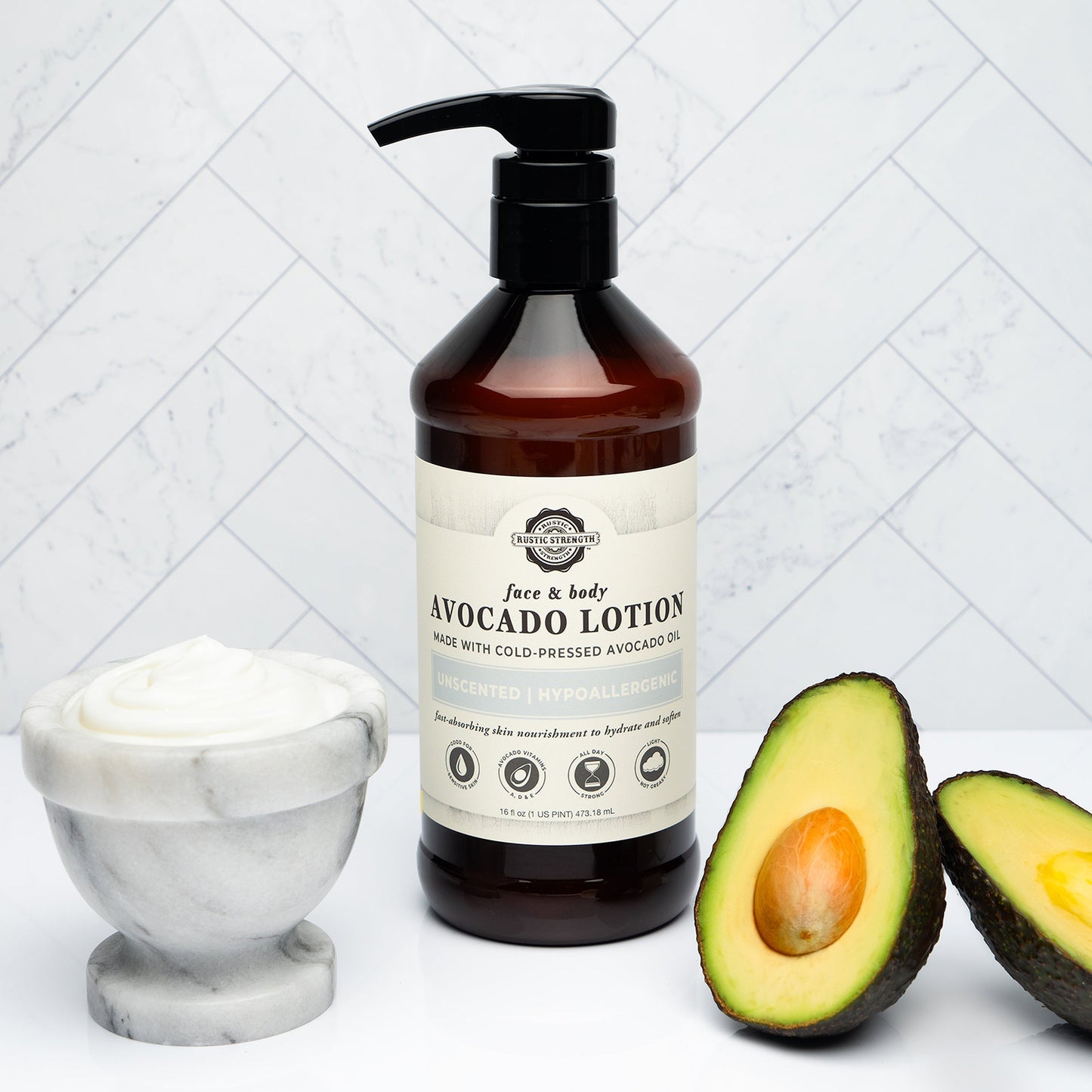 Rustic Strength Avocado Lotion with rosemary and mint in a 16 oz bottle, showing the creamy lotion texture and fresh botanical ingredients.