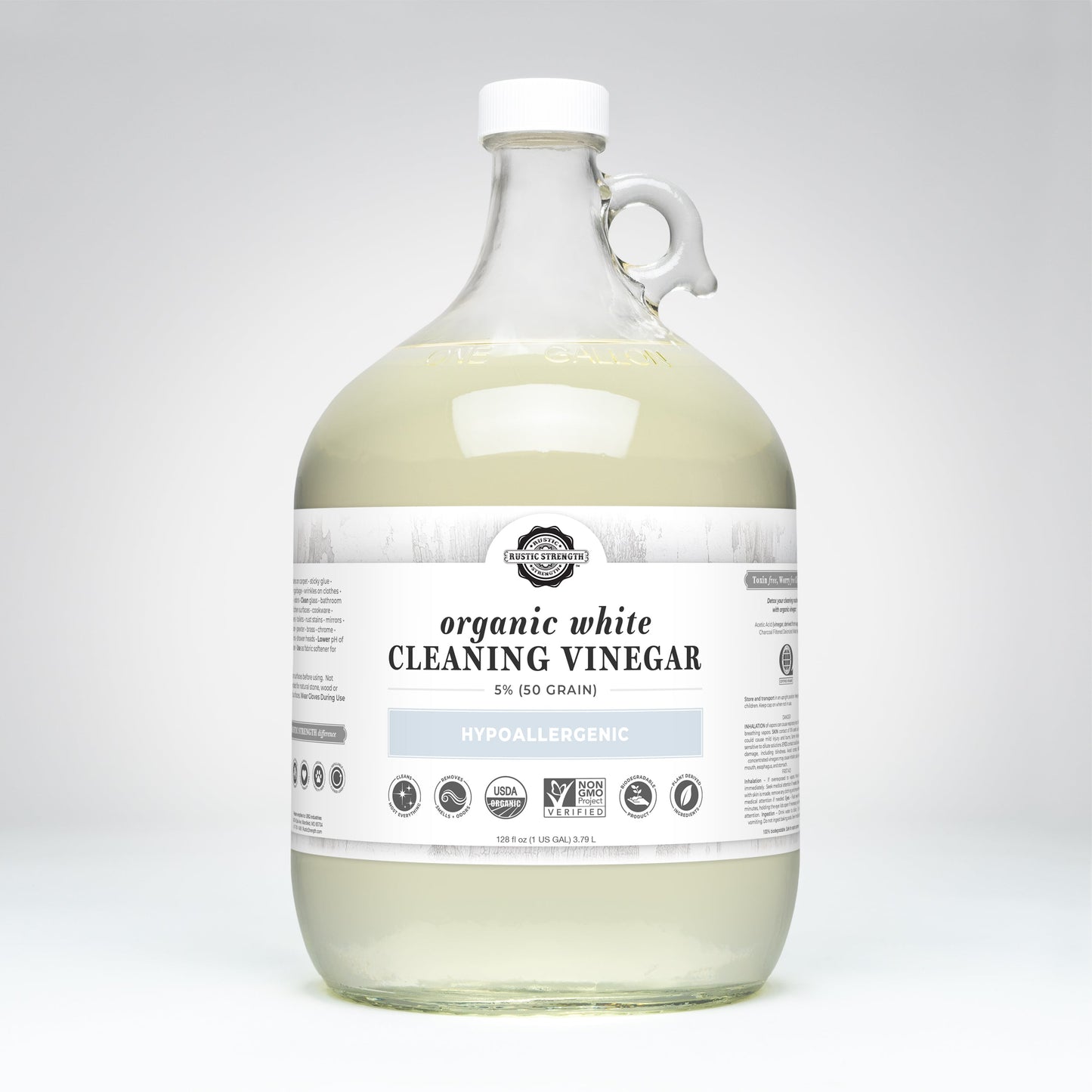 Rustic Strength Organic White Cleaning Vinegar | 5% (50 grain) comes in a clear, handled gallon jug. The hypoallergenic, biodegradable, non-GMO vinegar has various certifications noted on a white label.