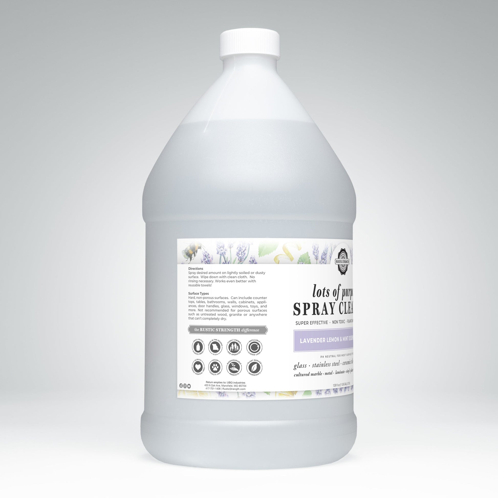Rustic Strength’s Lots of Purpose Spray Cleaner | Lavender, Lemon & Mint is a plant-based, toxin-free, pH-balanced cleaner in a large translucent jug with white cap; front label displays directions and surface icons.