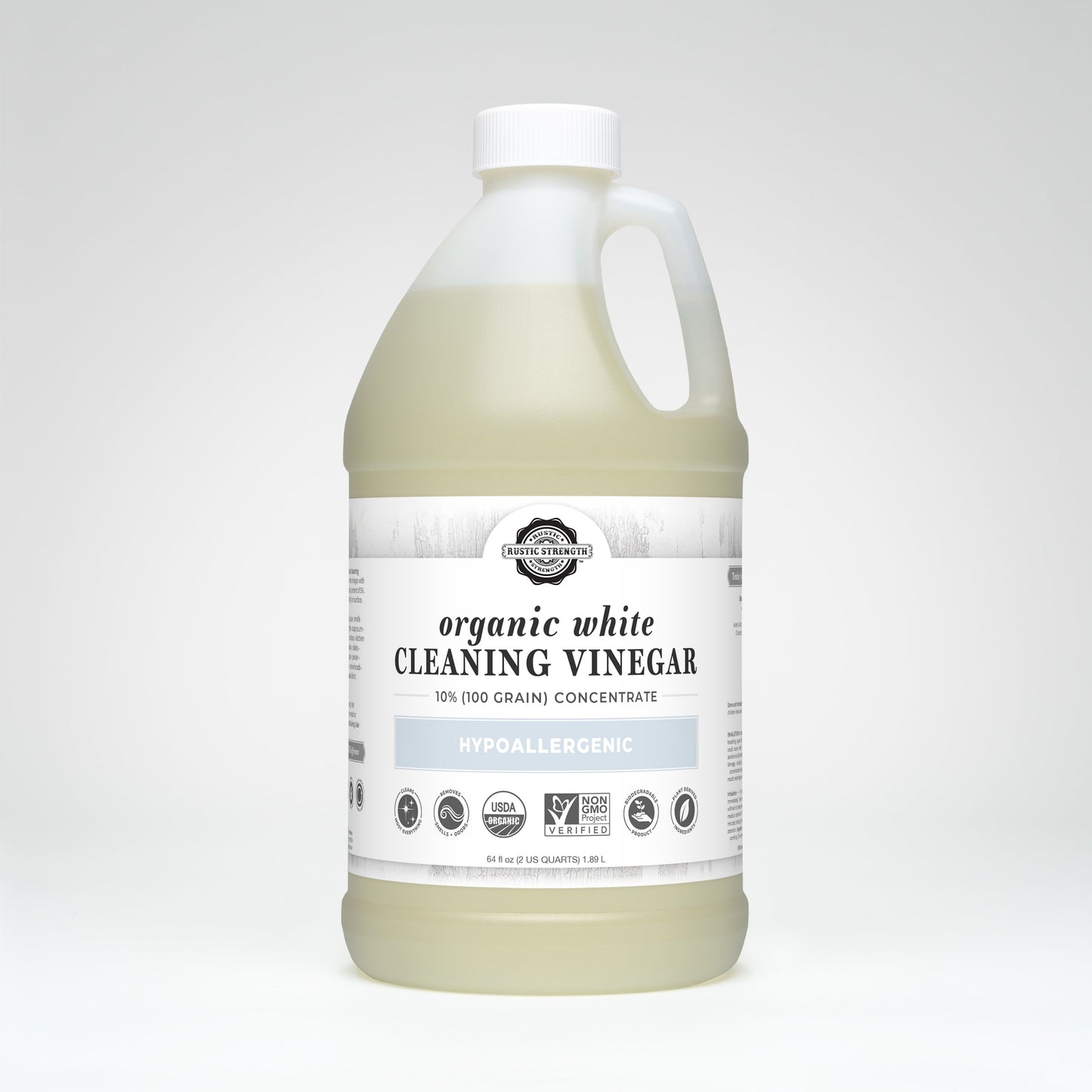 A large plastic jug of Rustic Strength Organic White Cleaning Vinegar Concentrate (10%, 100 grain) with a handle and white label, showing it is hypoallergenic, biodegradable, Non-GMO, and USDA organic. Background is plain white.