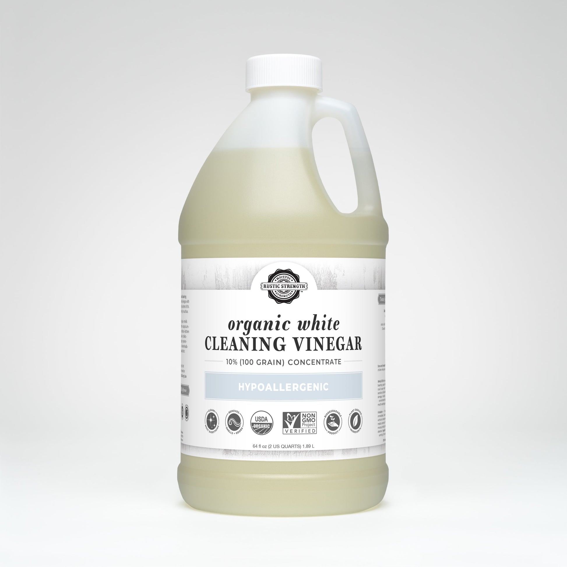 A large plastic jug of Rustic Strength Organic White Cleaning Vinegar Concentrate (10%, 100 grain) with a handle and white label, showing it is hypoallergenic, biodegradable, Non-GMO, and USDA organic. Background is plain white.
