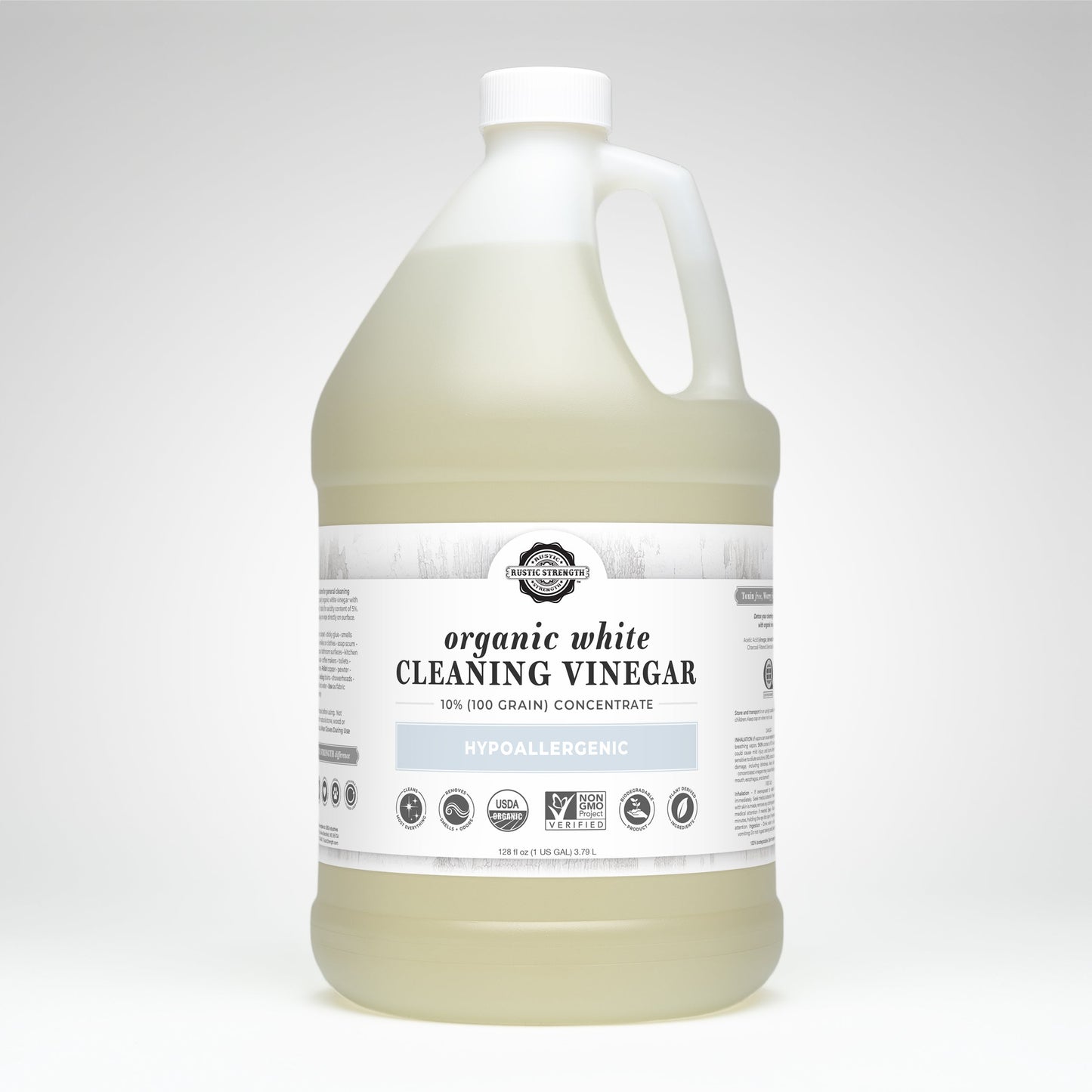 A large plastic jug of Rustic Strength Organic White Cleaning Vinegar Concentrate | 10% (100 grain), with a white cap and handle. The hypoallergenic, Non-GMO, biodegradable vinegar is made from 100% grain. Set against a plain light background.