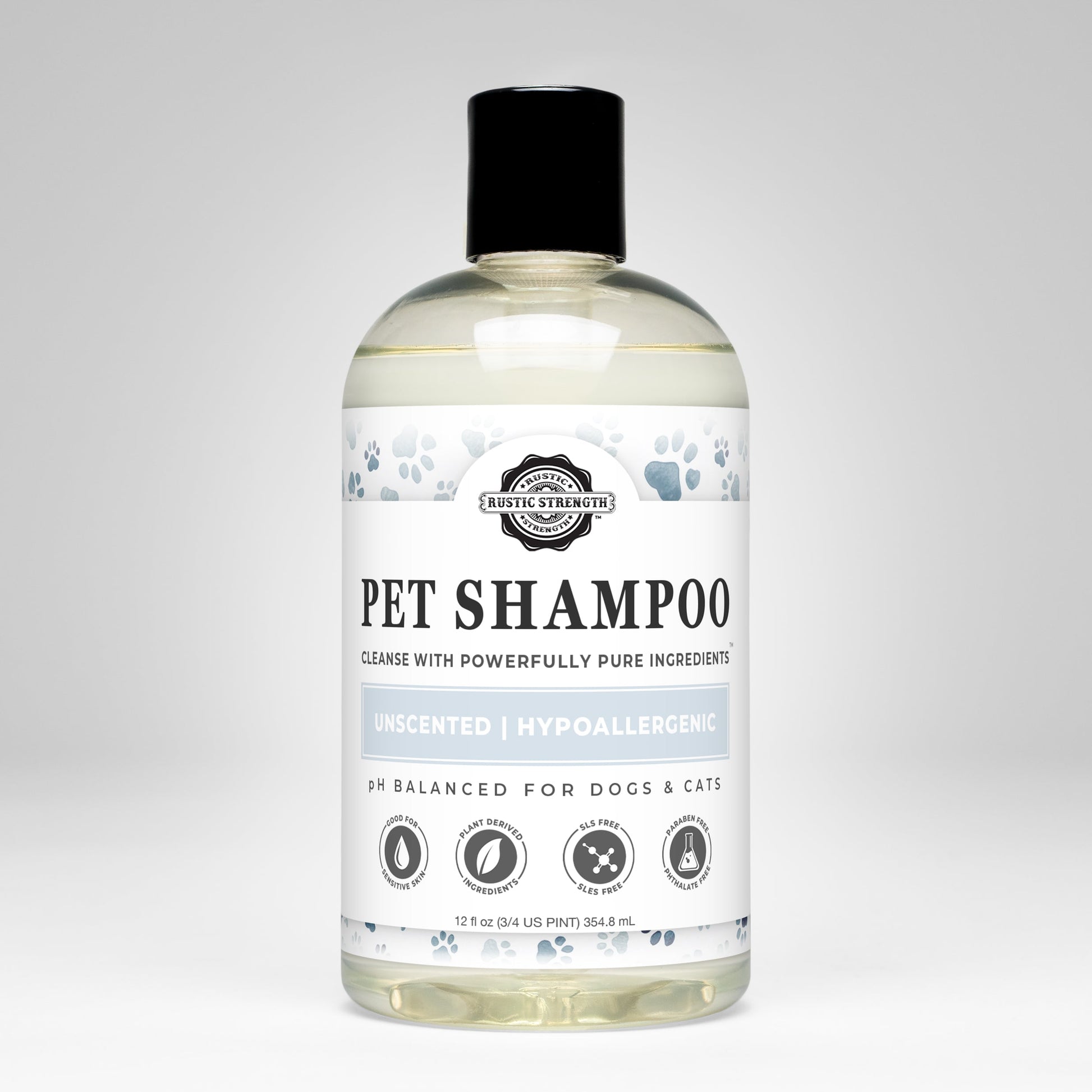 A clear bottle of Rustic Strength Pet Shampoo | Soothing & Deodorizing | Unscented with a black cap features blue paw prints, plant-based and hypoallergenic text, and icons for non-toxic, dog- and cat-safe use.
